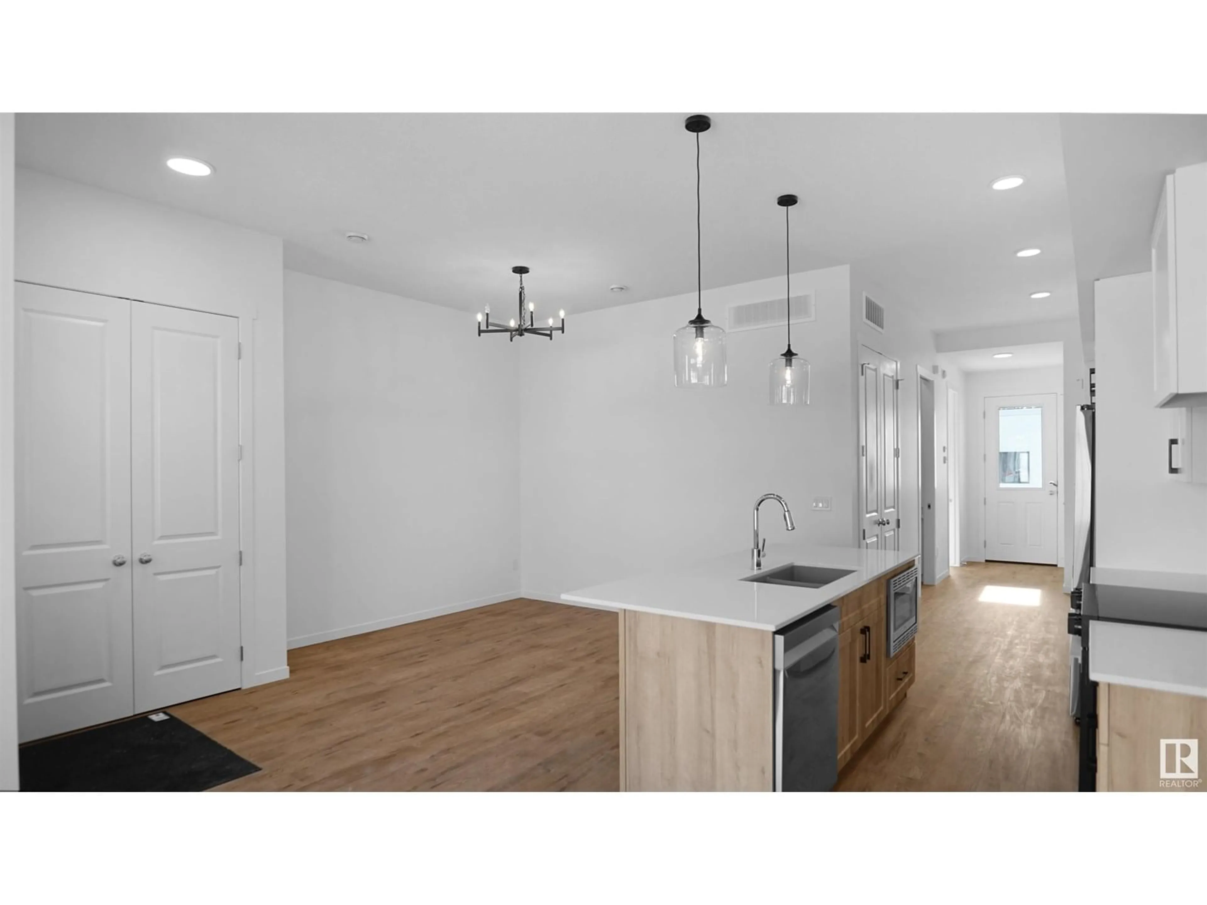 Open concept kitchen, wood/laminate floor for NW - 20605 42 AV, Edmonton Alberta T6M0R8