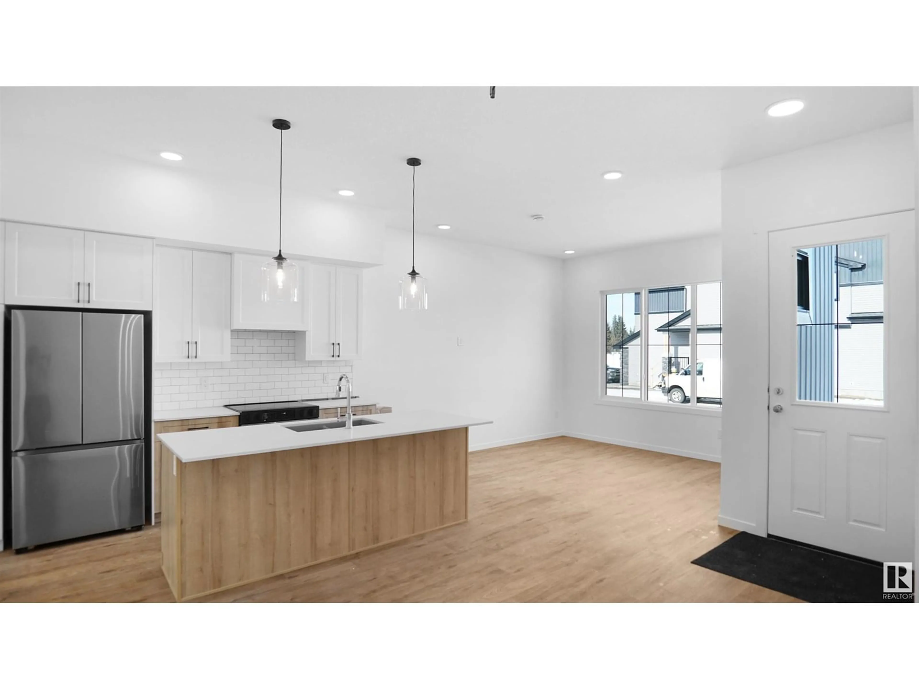 Open concept kitchen, wood/laminate floor for NW - 20605 42 AV, Edmonton Alberta T6M0R8