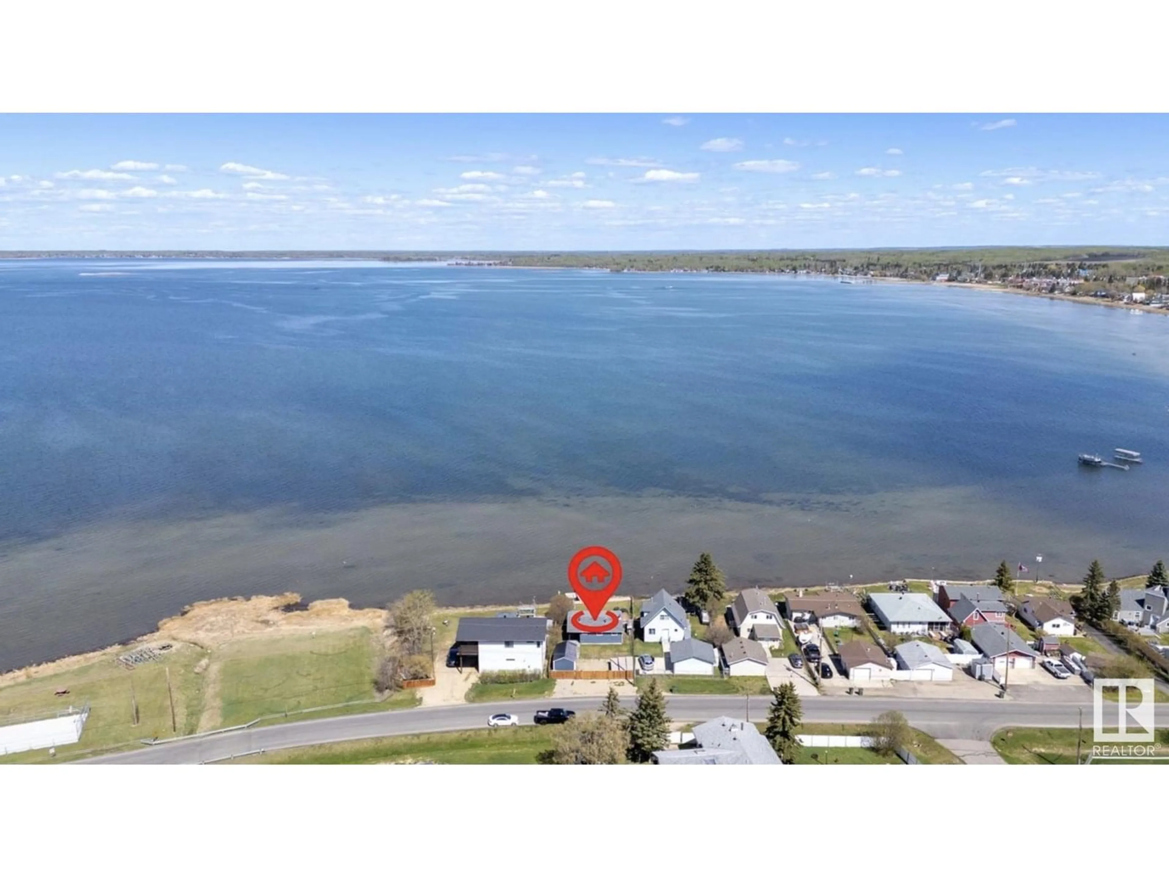 A pic from outside/outdoor area/front of a property/back of a property/a pic from drone, water/lake/river/ocean view for 6330 STE ANNE TRAIL, Rural Lac Ste. Anne County Alberta T0E0A0