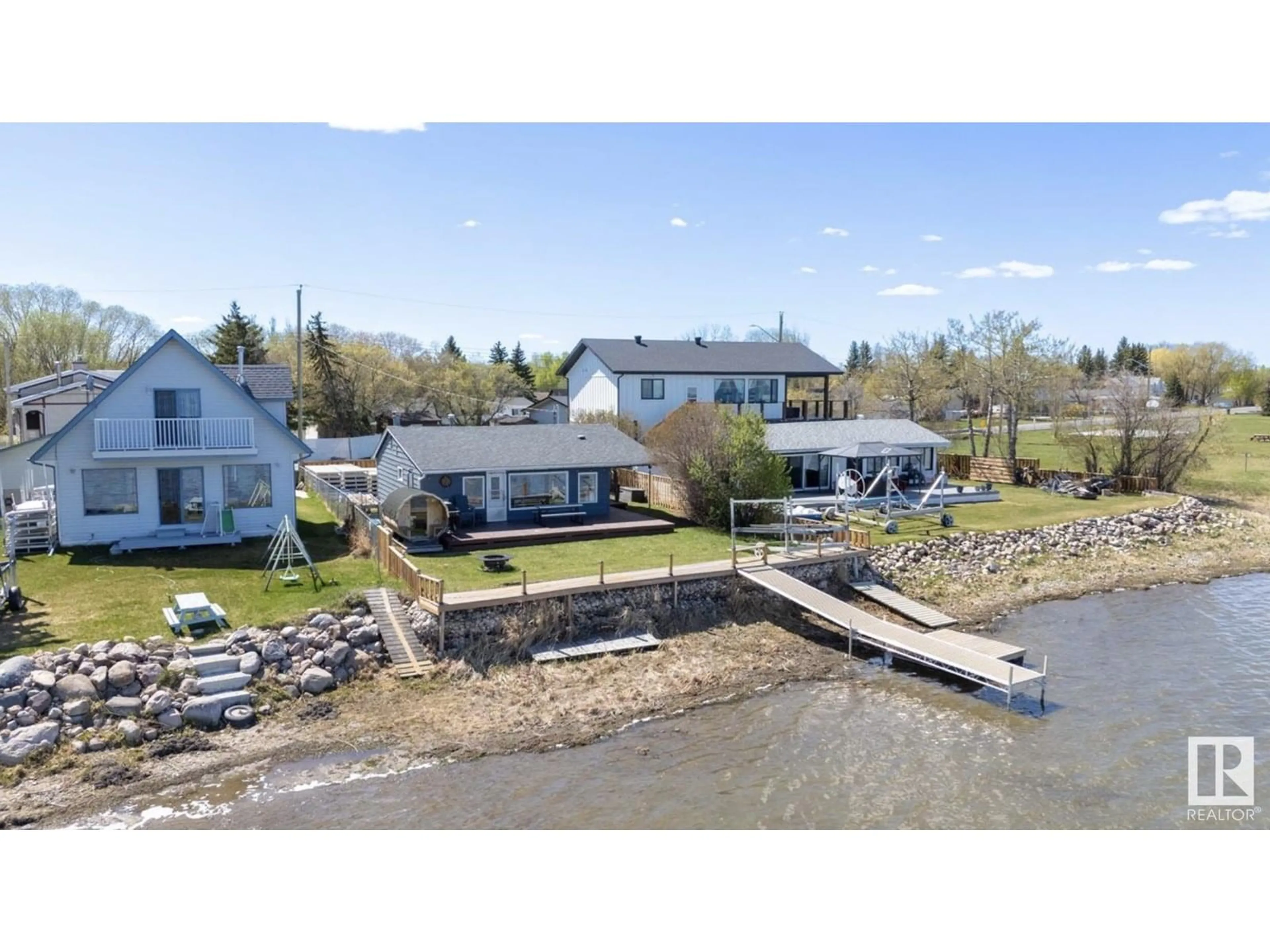 A pic from outside/outdoor area/front of a property/back of a property/a pic from drone, water/lake/river/ocean view for 6330 STE ANNE TRAIL, Rural Lac Ste. Anne County Alberta T0E0A0
