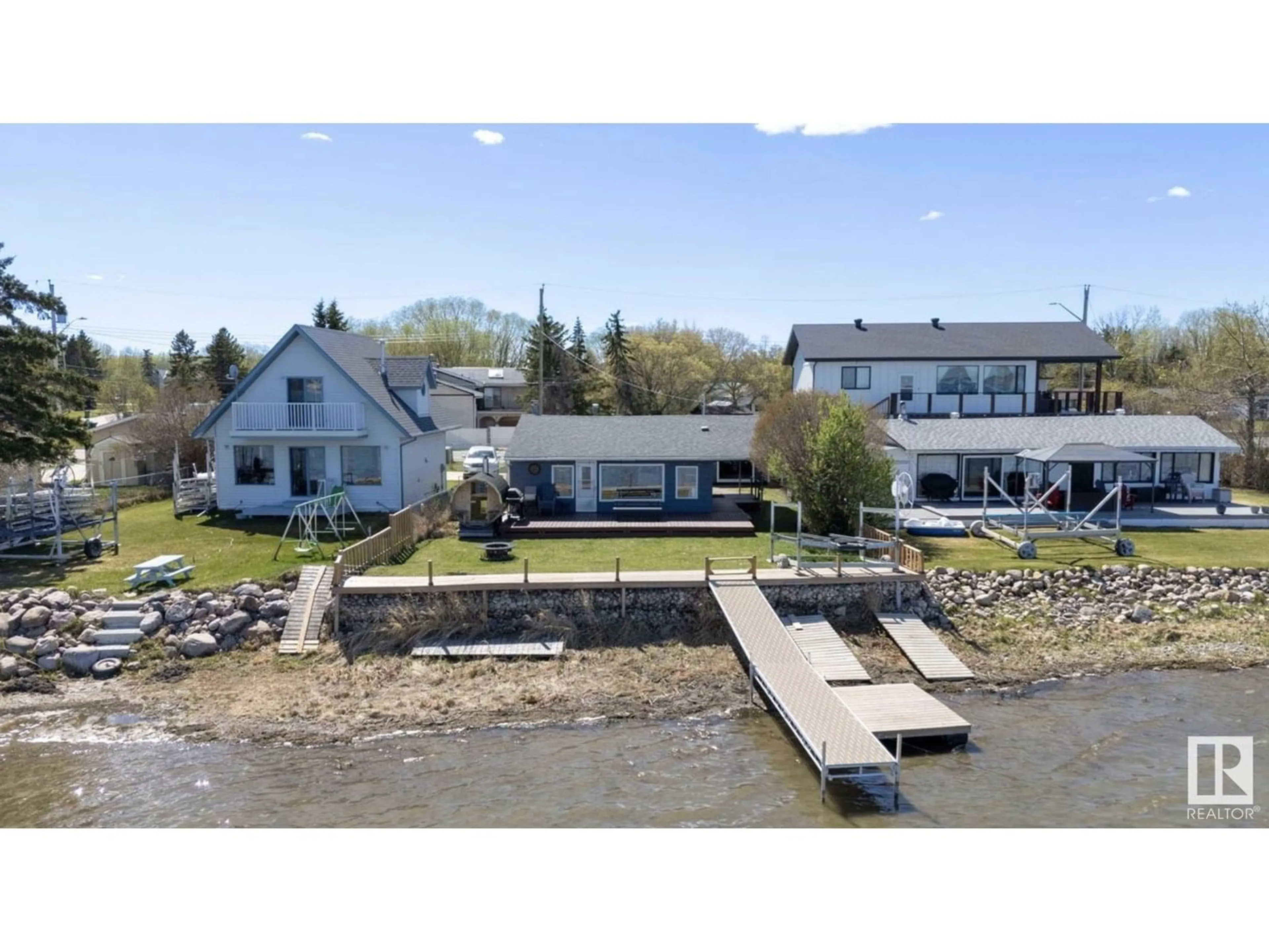A pic from outside/outdoor area/front of a property/back of a property/a pic from drone, water/lake/river/ocean view for 6330 STE ANNE TRAIL, Rural Lac Ste. Anne County Alberta T0E0A0
