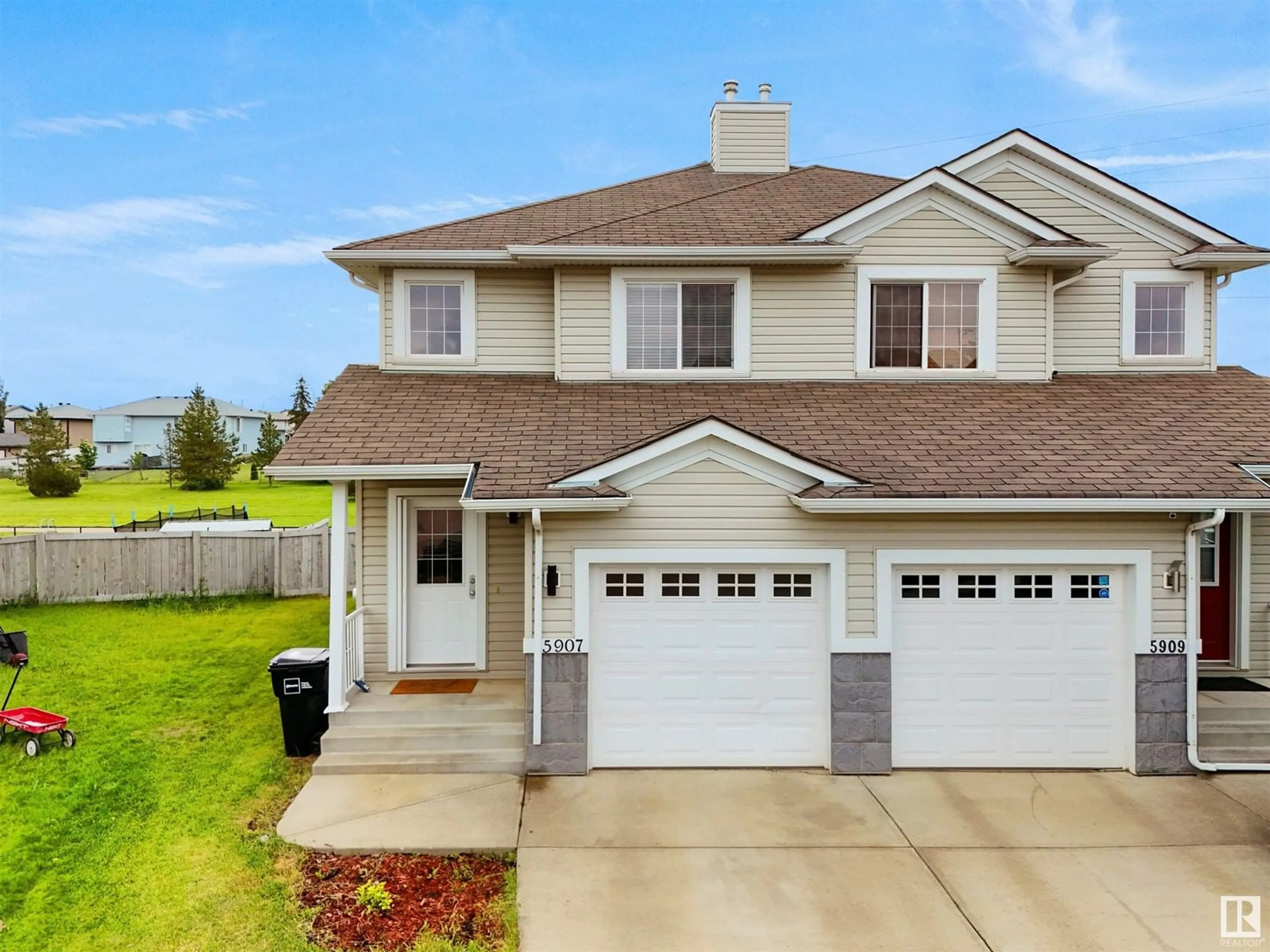 Home with vinyl exterior material, street for 5907 164 AV, Edmonton Alberta T5Y0B3