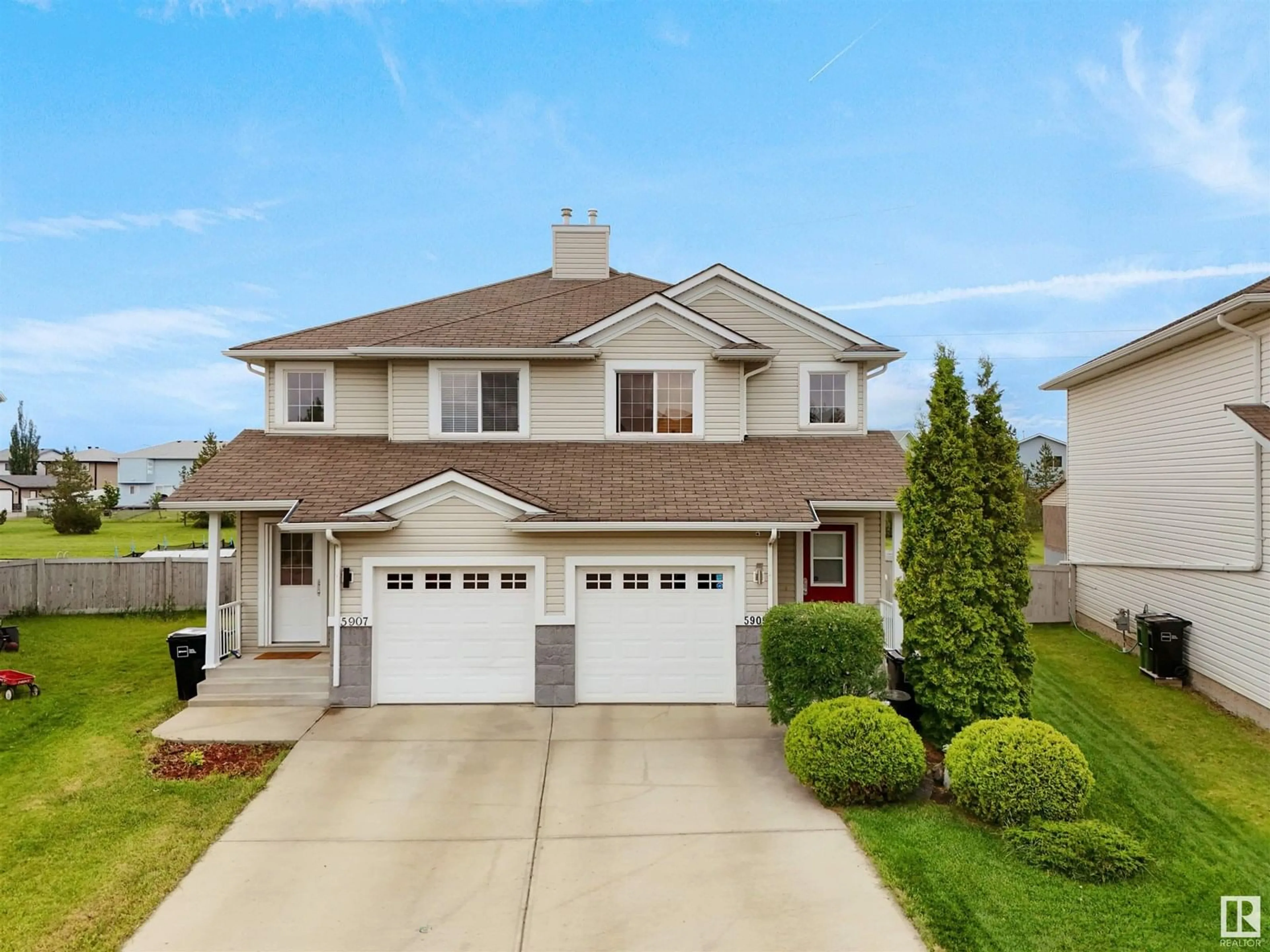 Home with vinyl exterior material, street for 5907 164 AV, Edmonton Alberta T5Y0B3
