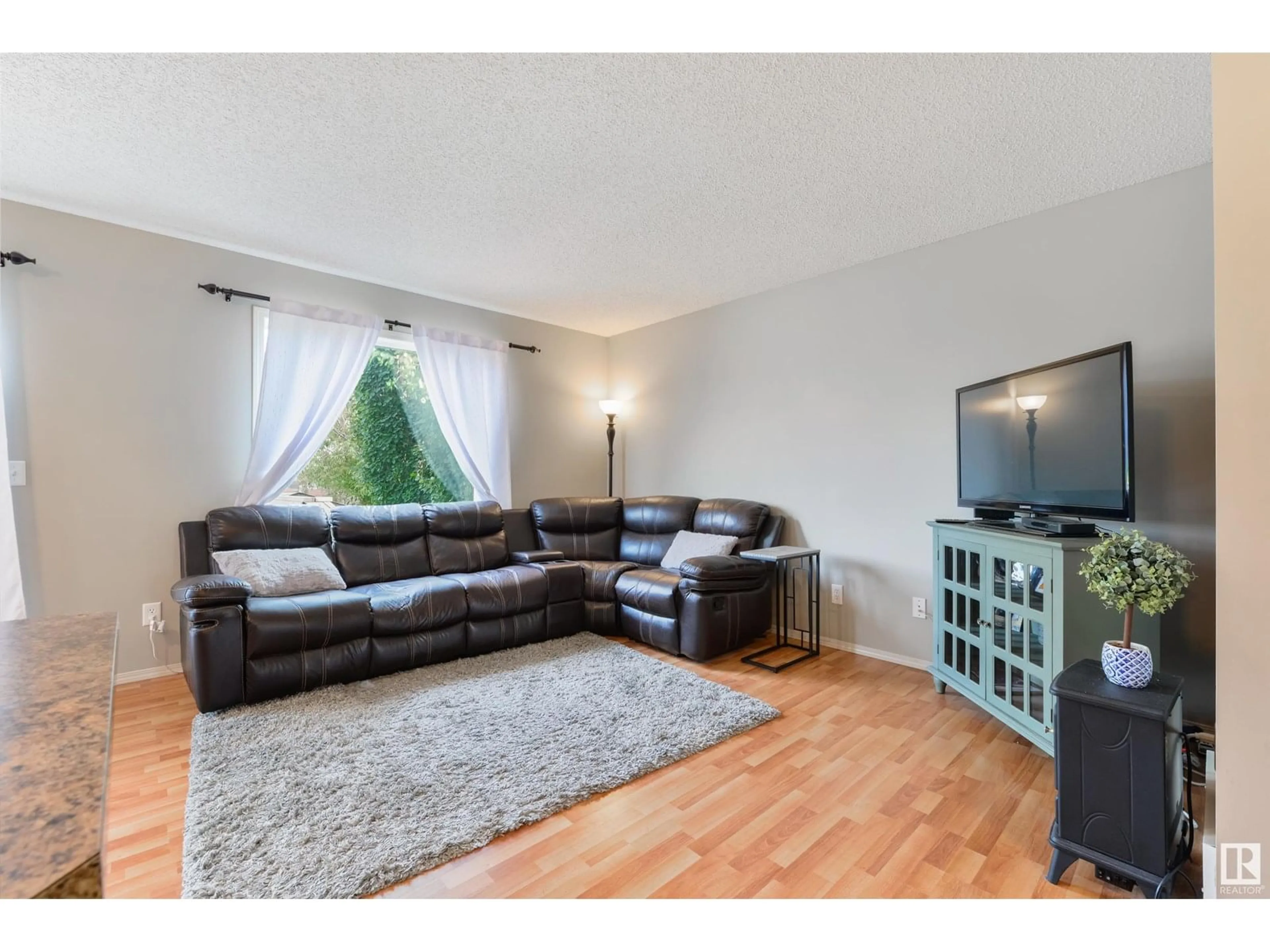 Living room with furniture, wood/laminate floor for 4 VANESSA AV, Spruce Grove Alberta T7X0B9