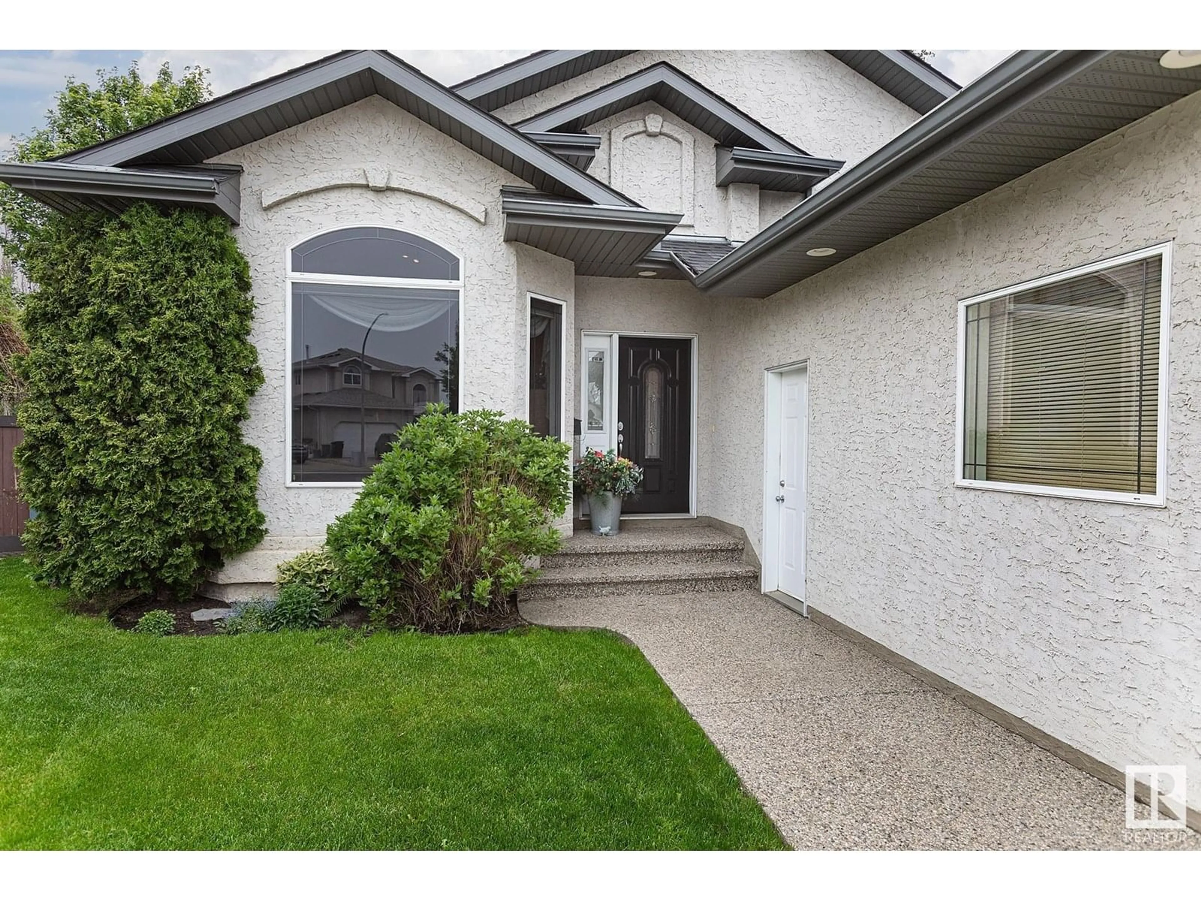 Home with vinyl exterior material, street for NW - 16135 72 ST, Edmonton Alberta T5Z3T8