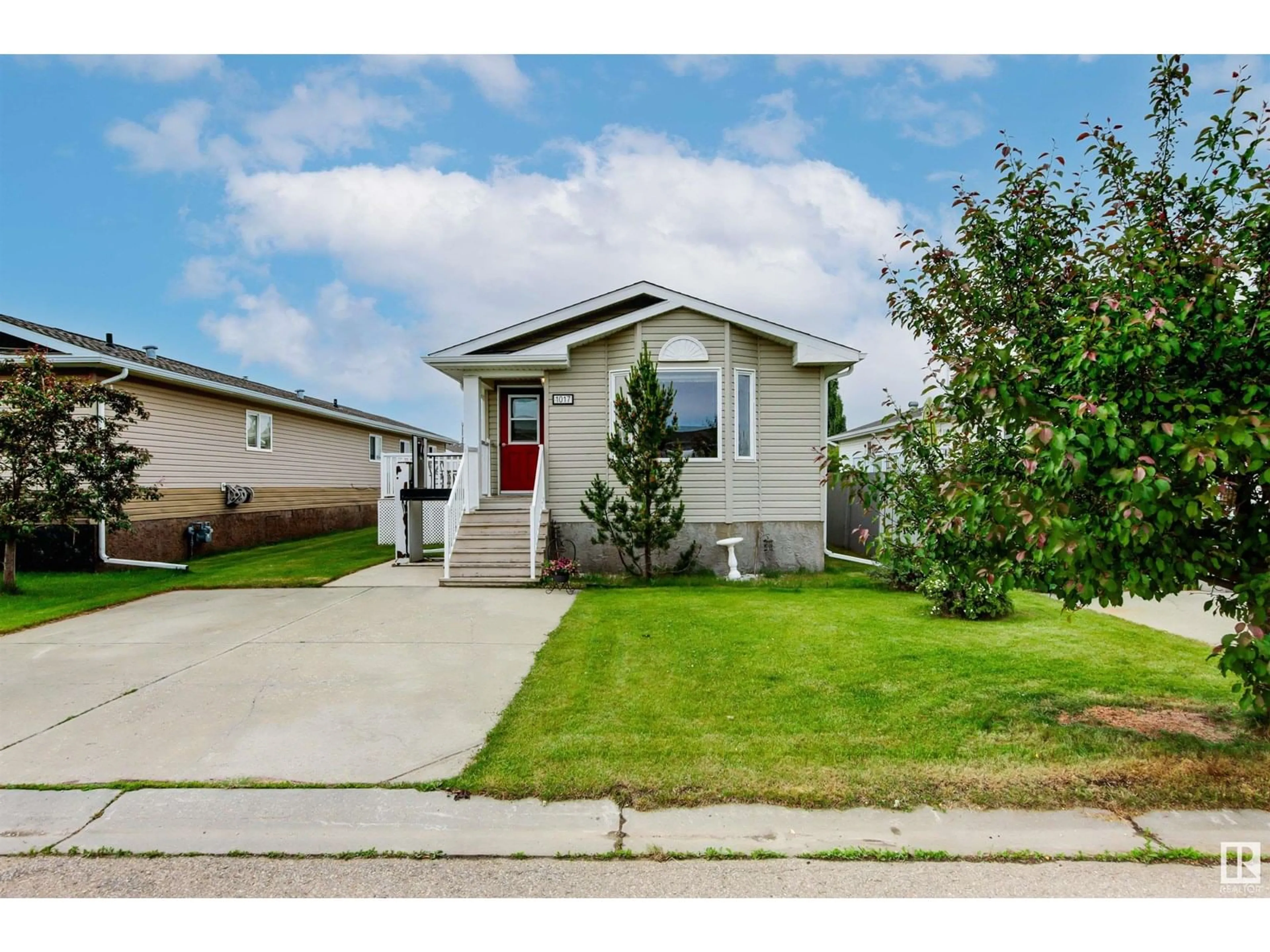 Home with vinyl exterior material, street for E - 1017 ASPEN DR, Leduc Alberta T9E8R5