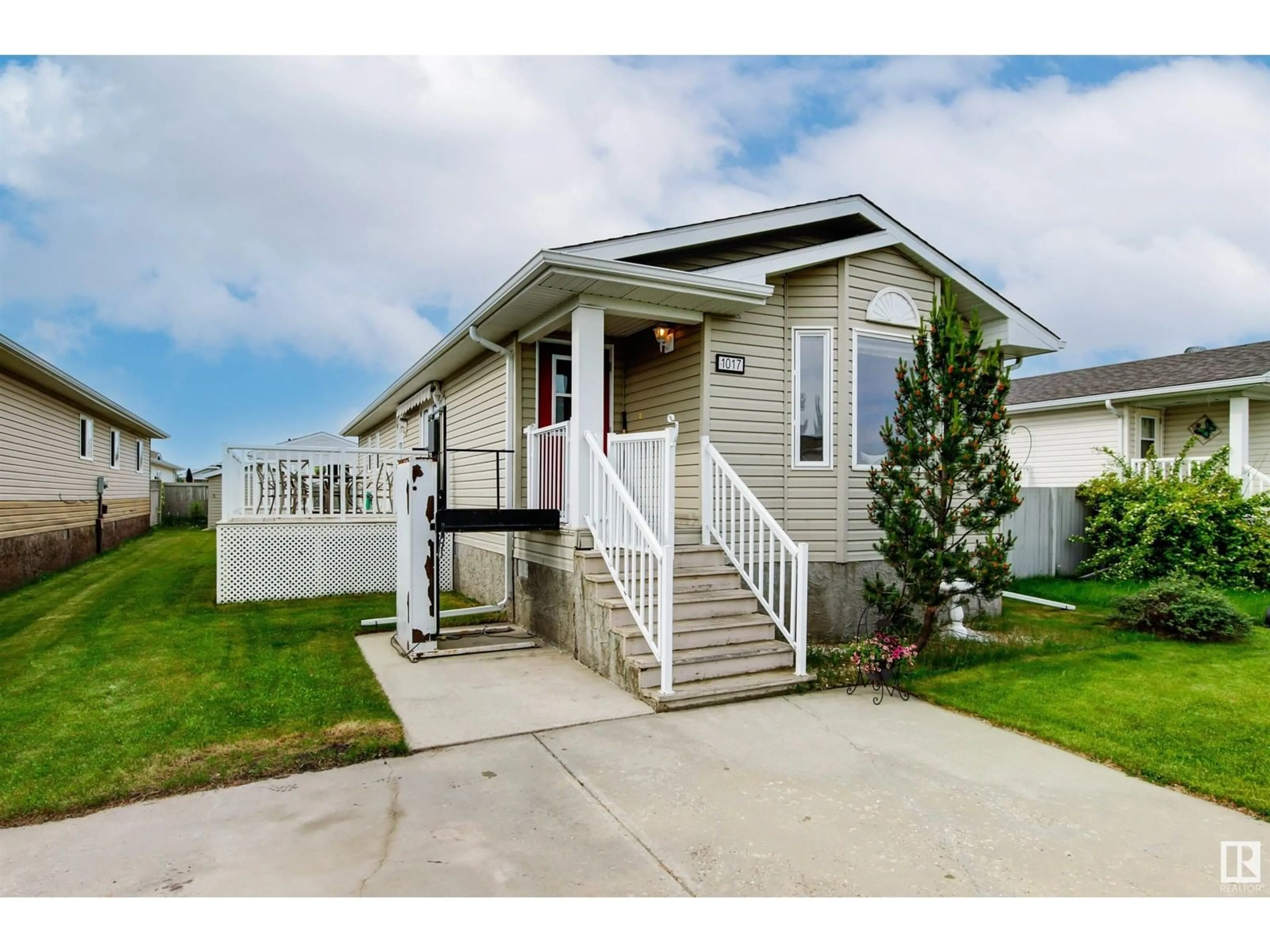 Home with vinyl exterior material, street for E - 1017 ASPEN DR, Leduc Alberta T9E8R5