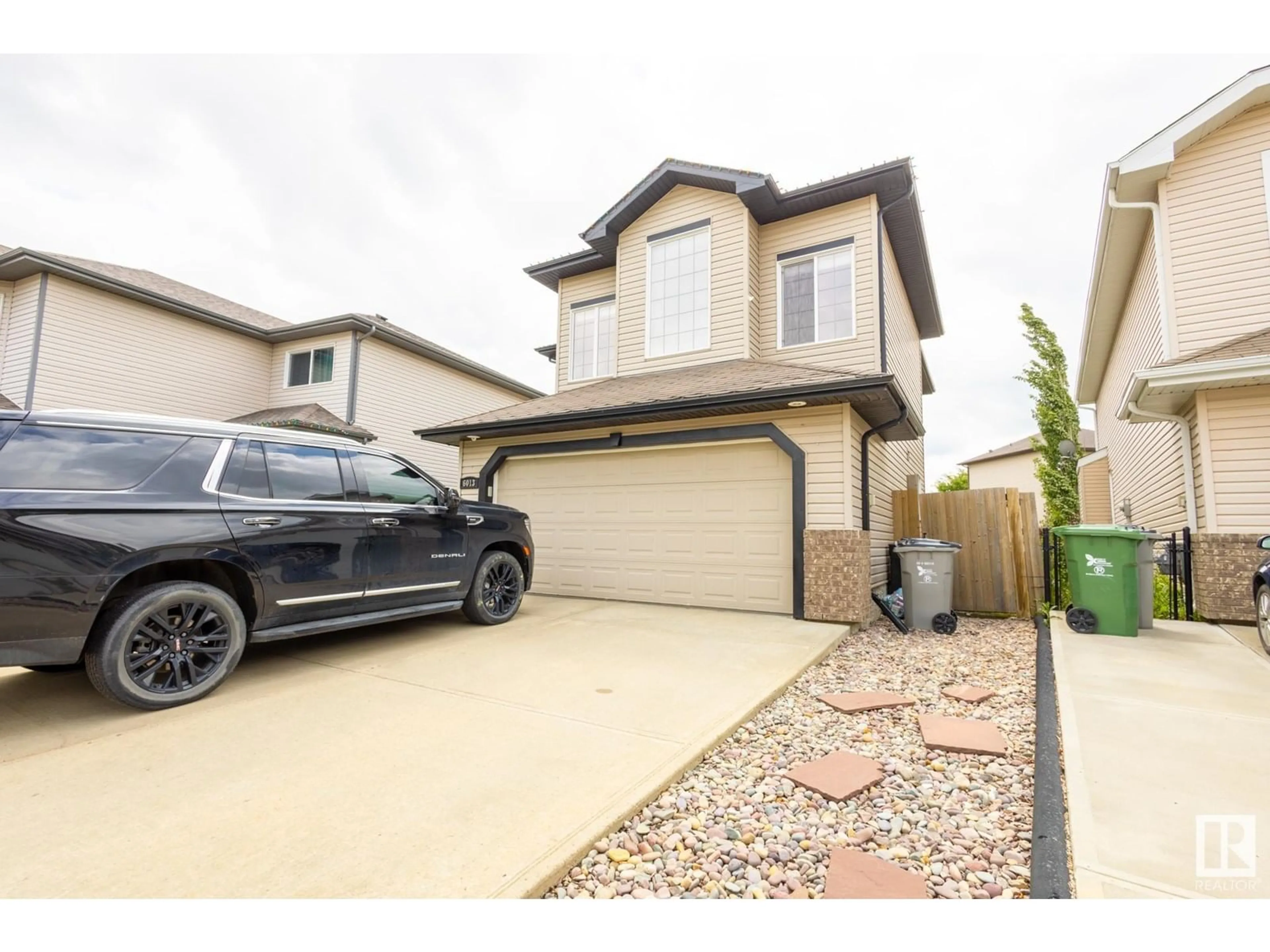 Home with vinyl exterior material, street for 6013 48 AVENUE, Beaumont Alberta T4X0A3
