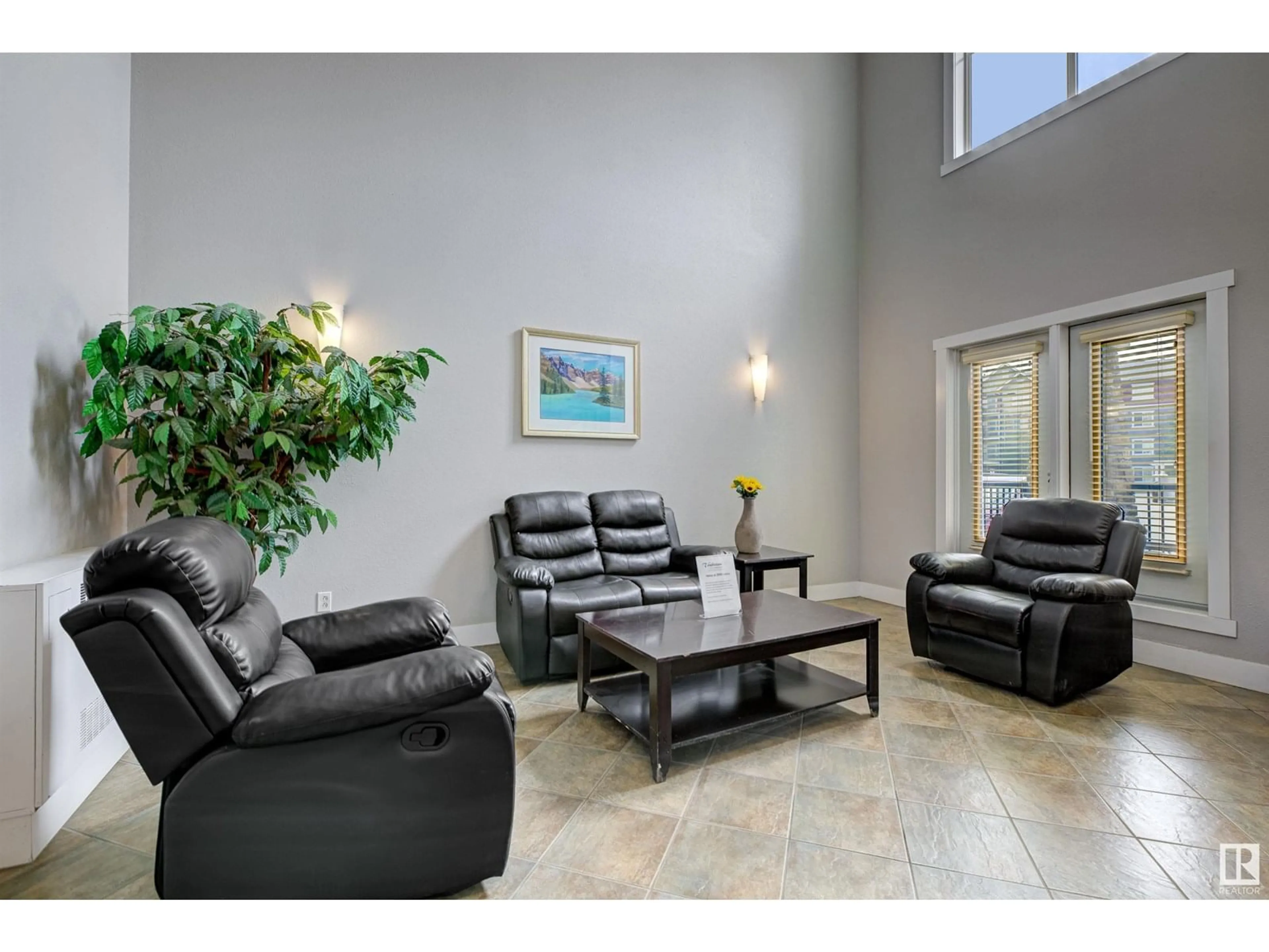 Living room with furniture, ceramic/tile floor for 2096 - 452 BLACKMUD CREEK DR, Edmonton Alberta T6W0G1