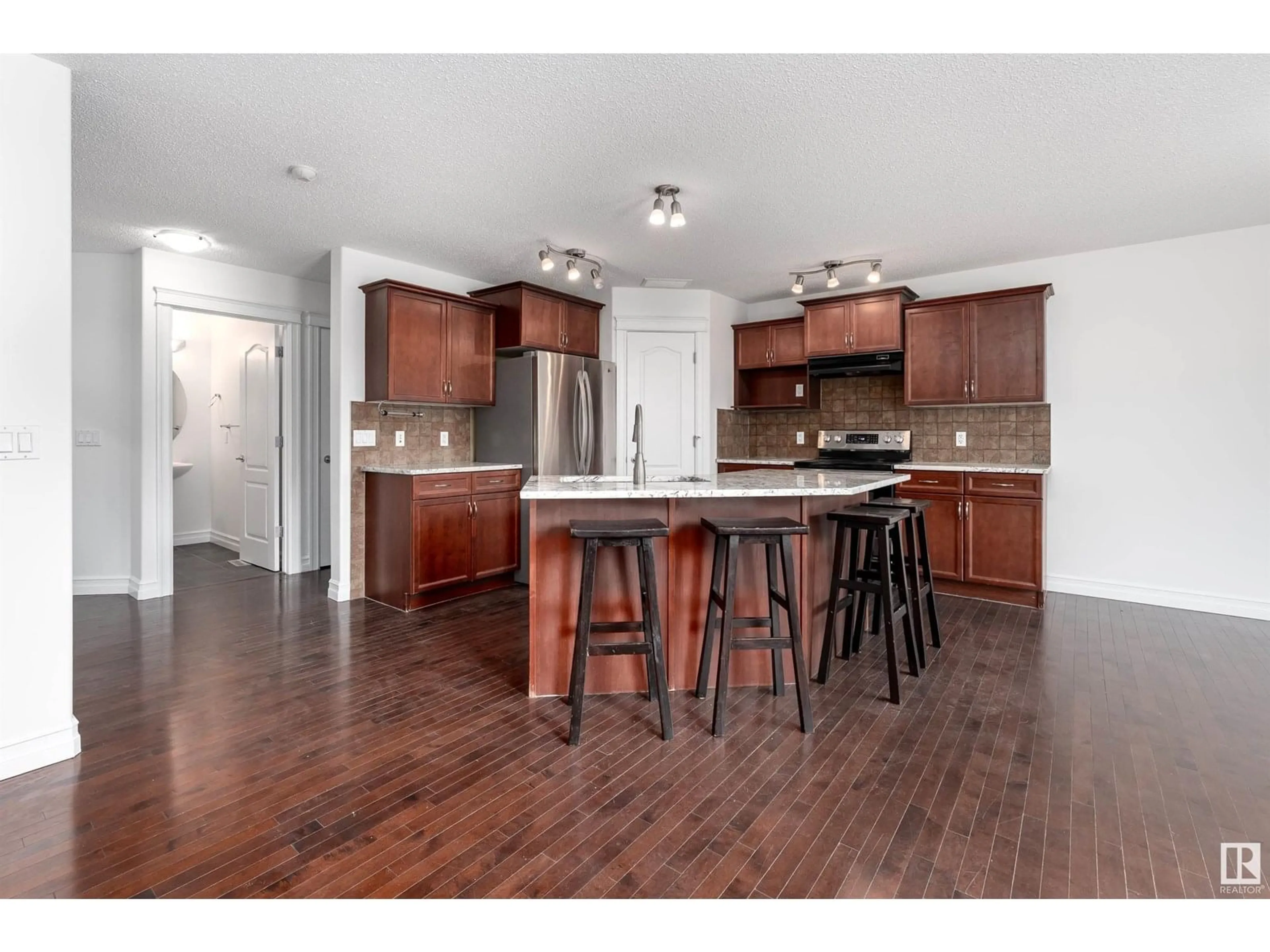 Open concept kitchen, wood/laminate floor for 3 SPRING GROVE CR, Spruce Grove Alberta T5Y0P7