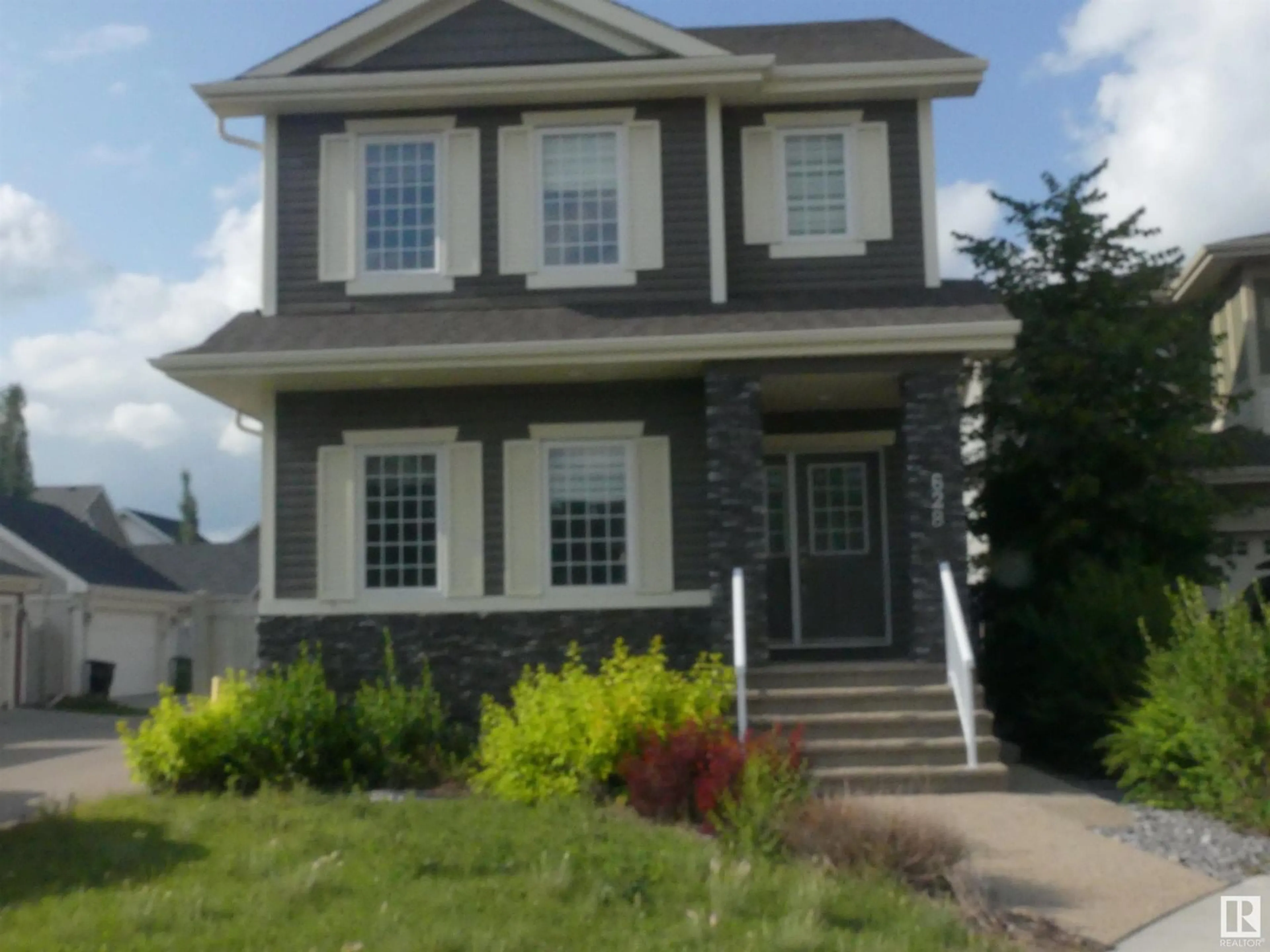 Home with vinyl exterior material, street for 628 ORTONA WY, Edmonton Alberta T5E6S9