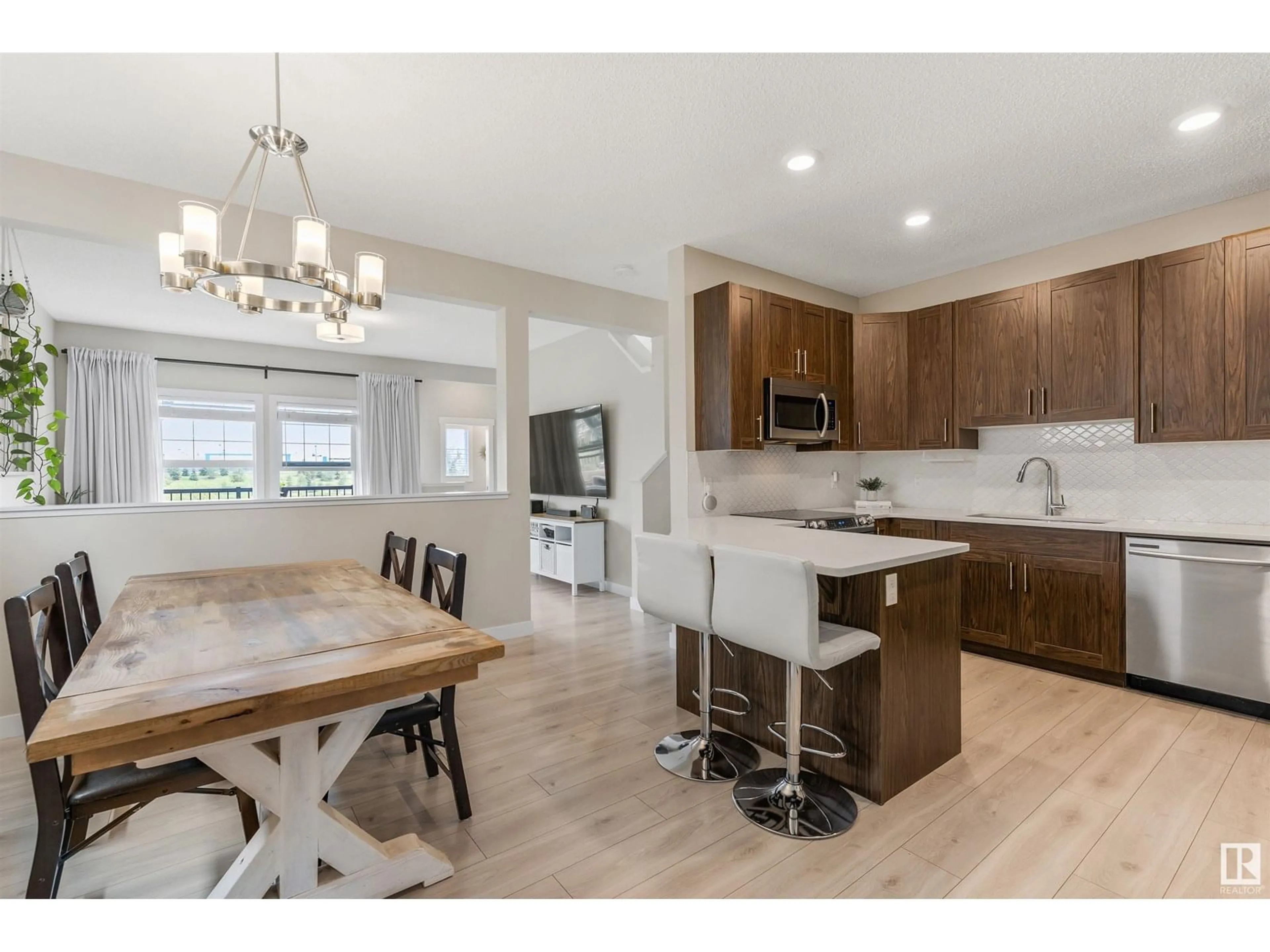 Open concept kitchen, wood/laminate floor for 66 JOYAL WY, St. Albert Alberta T8N7V5