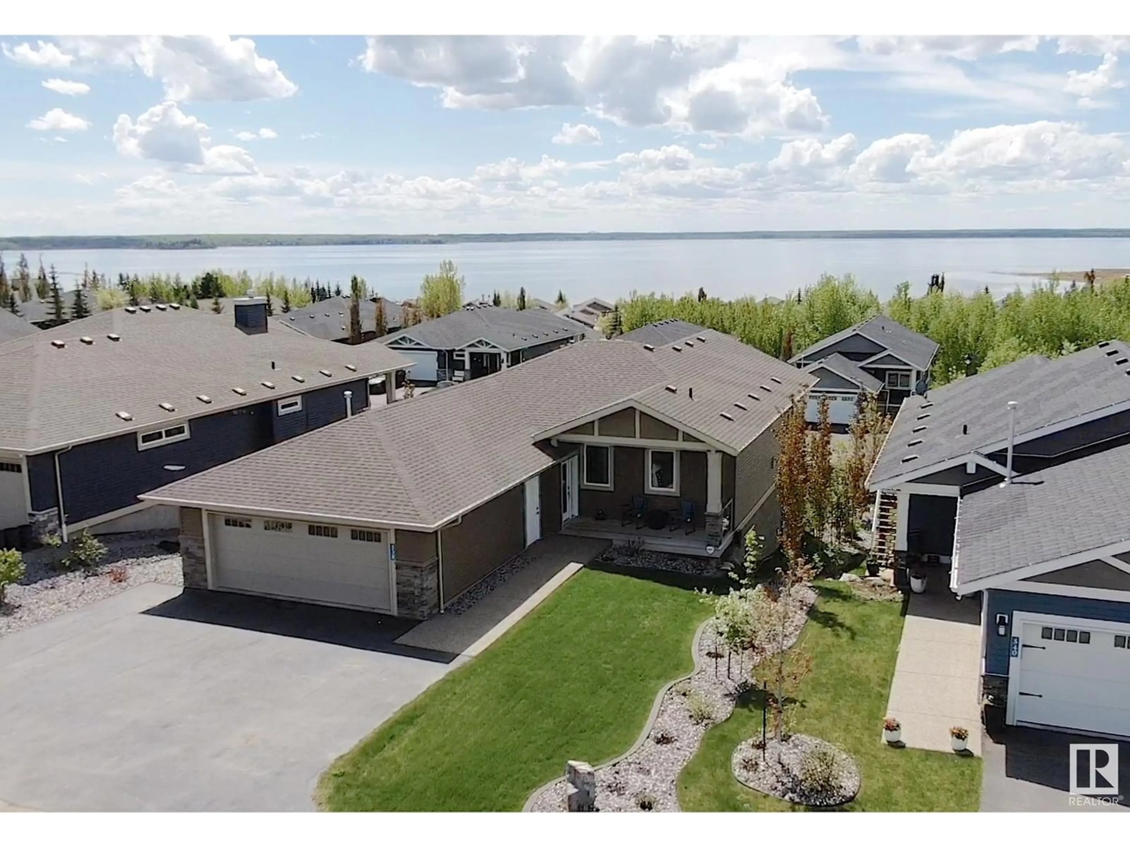 A pic from outside/outdoor area/front of a property/back of a property/a pic from drone, water/lake/river/ocean view for 55101 STE. ANNE TR, Rural Lac Ste. Anne County Alberta T0E1A0