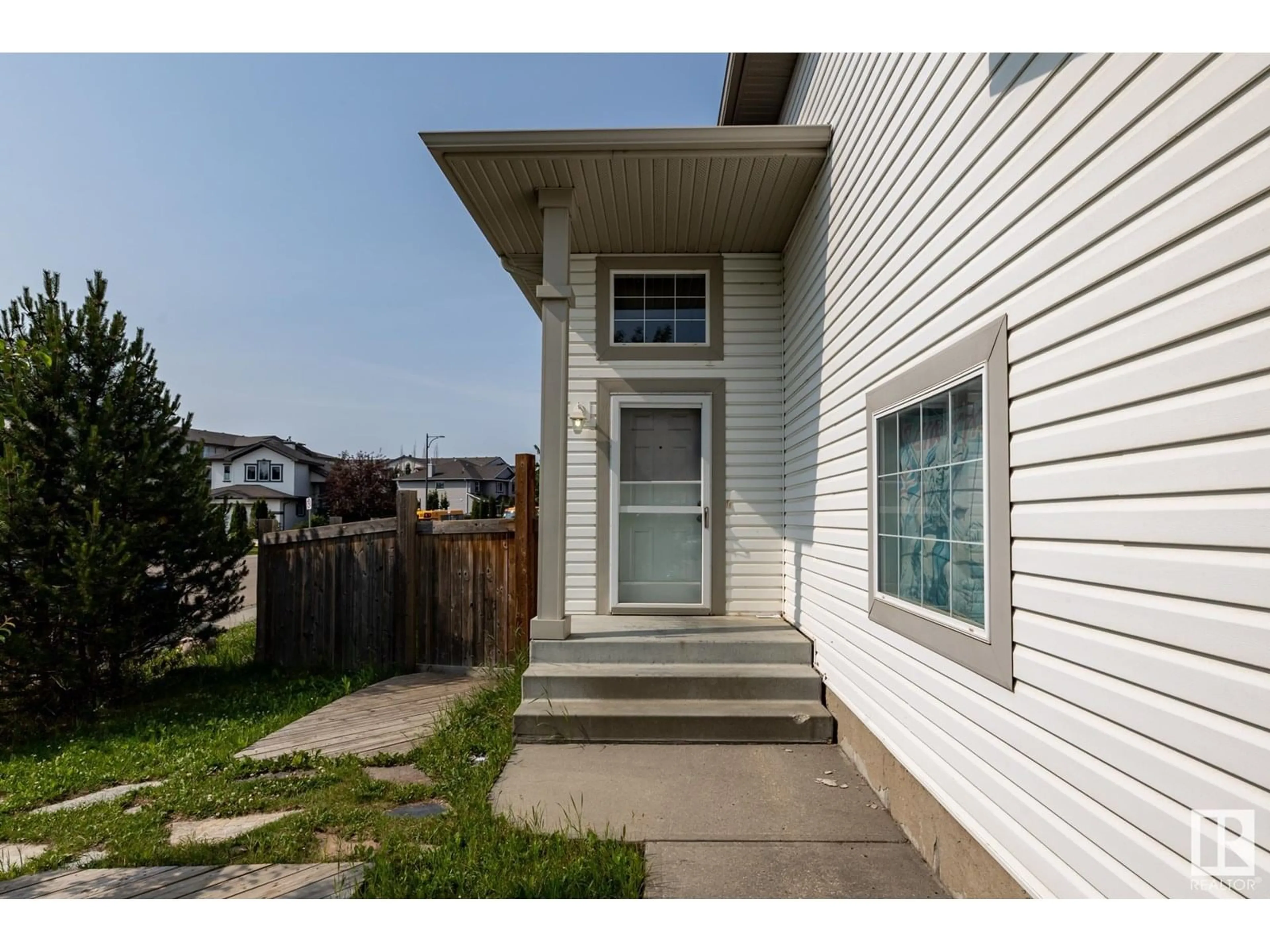 Home with vinyl exterior material, street for 514 79 ST, Edmonton Alberta T6X1N2