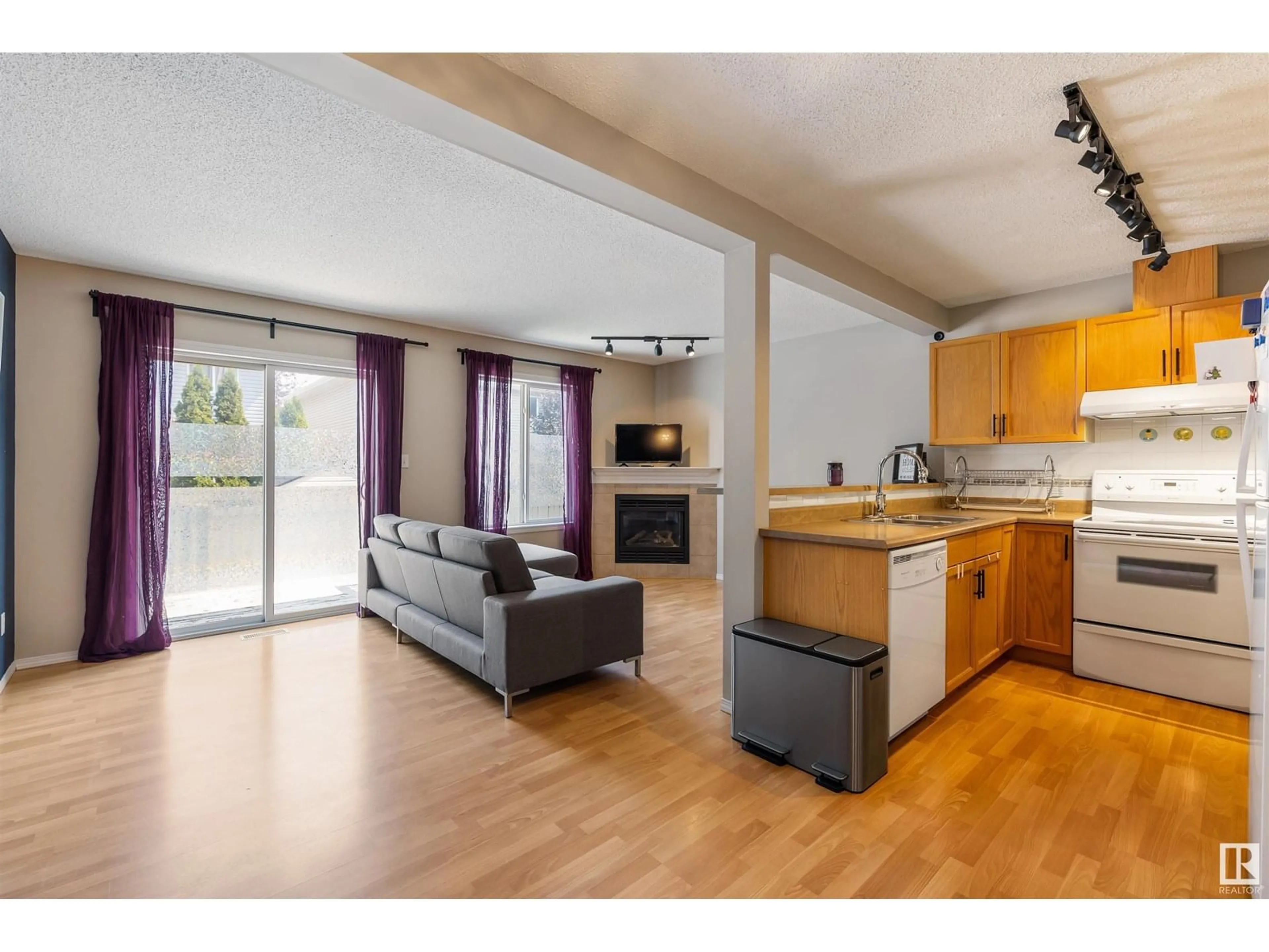 Open concept kitchen, wood/laminate floor for 14603 - 83 MILLER BV, Edmonton Alberta T5Y3B6