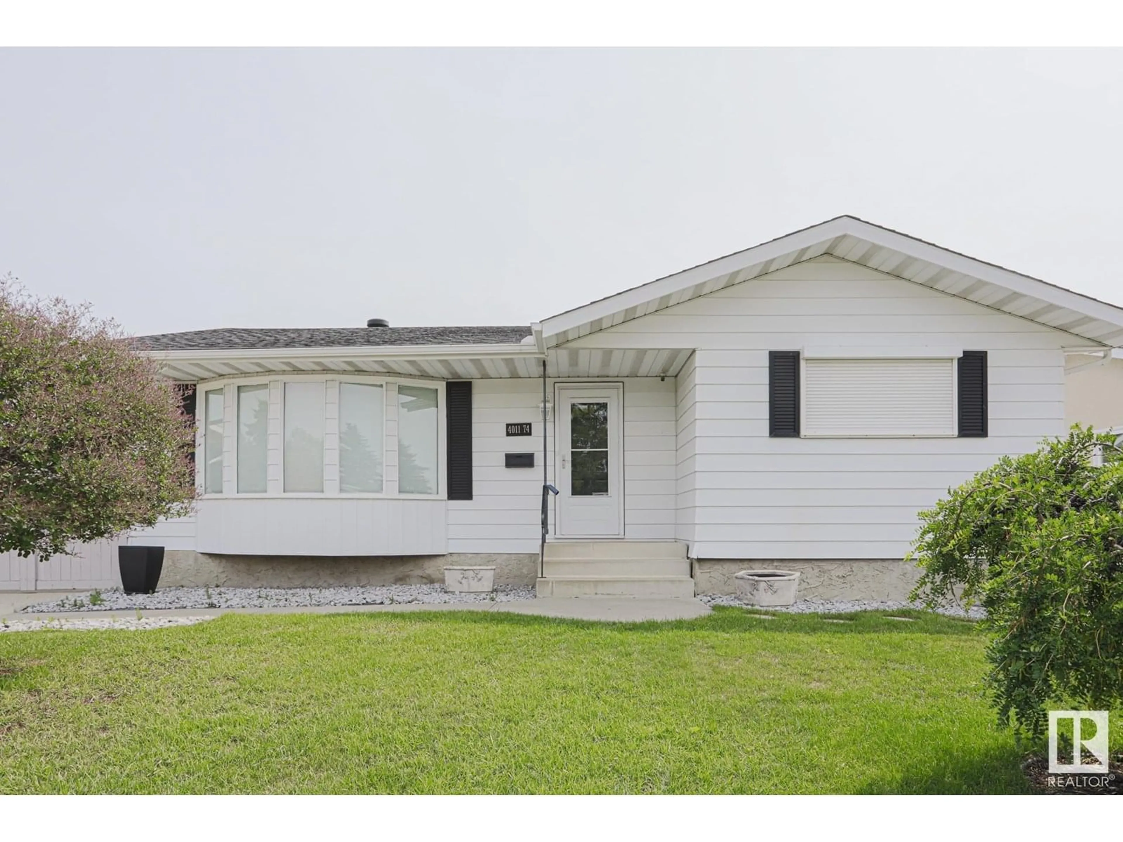 Home with vinyl exterior material, street for 4011 74 ST, Edmonton Alberta T6K0W7