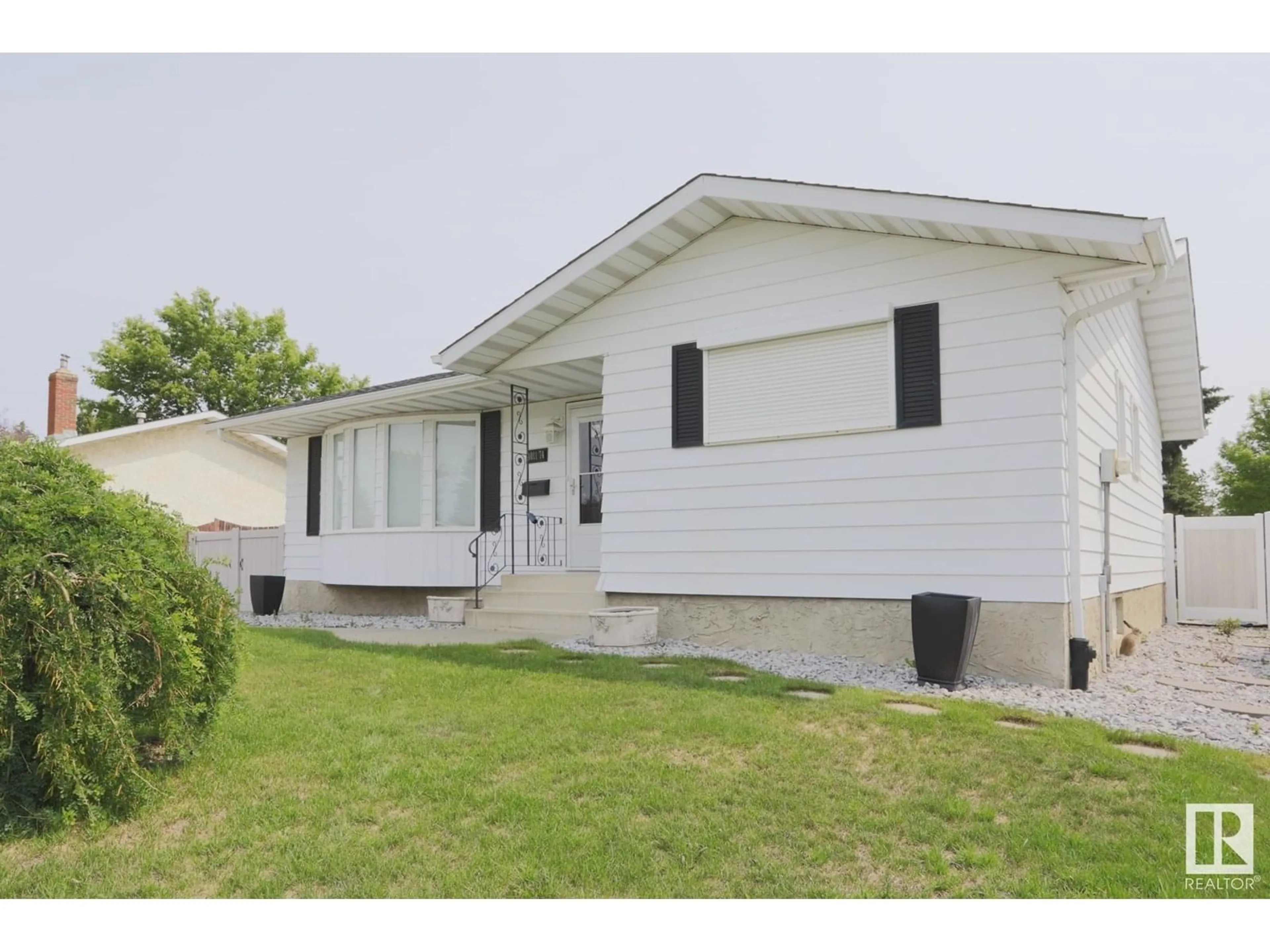 Home with vinyl exterior material, street for 4011 74 ST, Edmonton Alberta T6K0W7