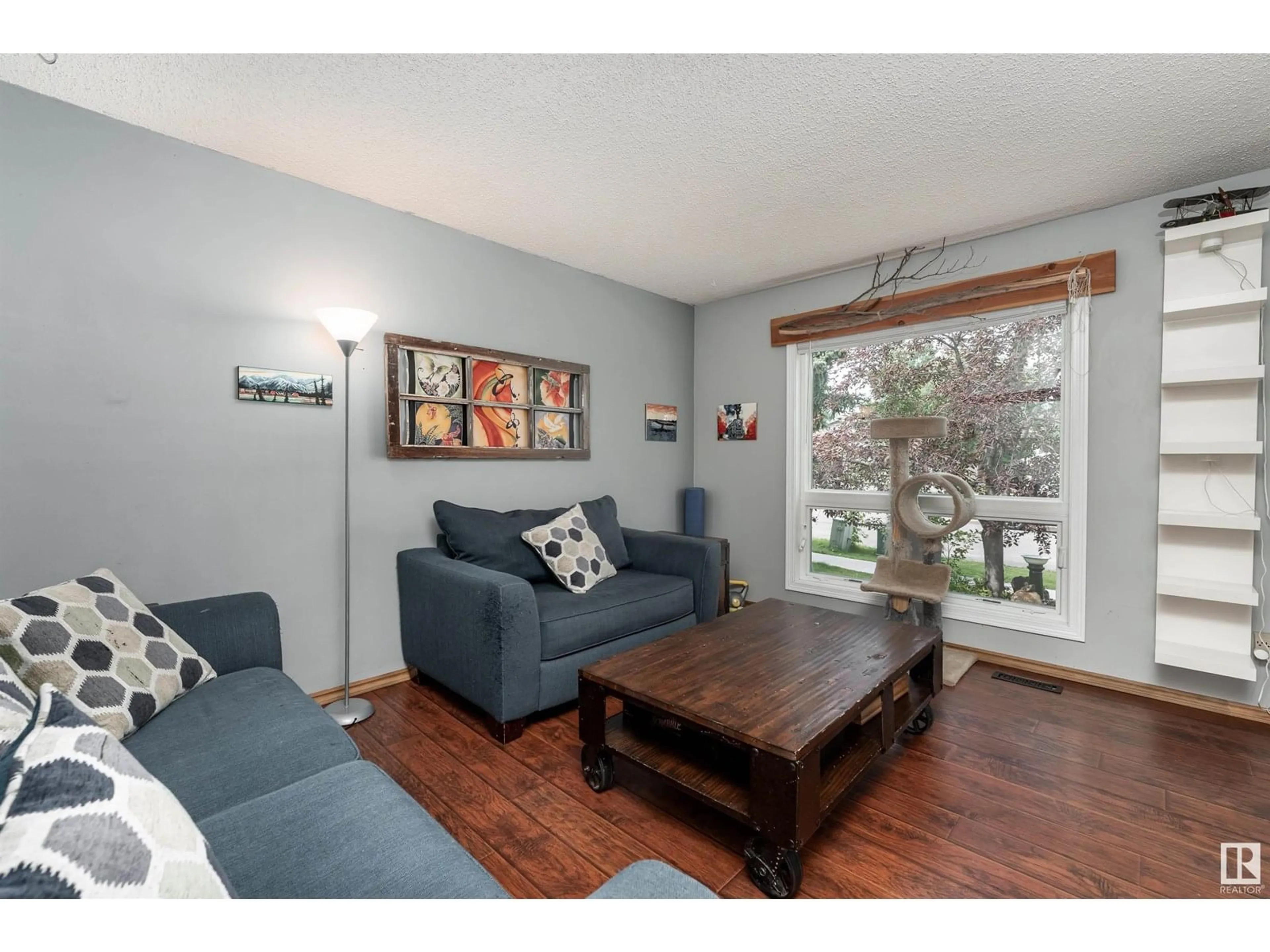 Living room with furniture, wood/laminate floor for 95 GREYSTONE DR, Spruce Grove Alberta T7X1Y7