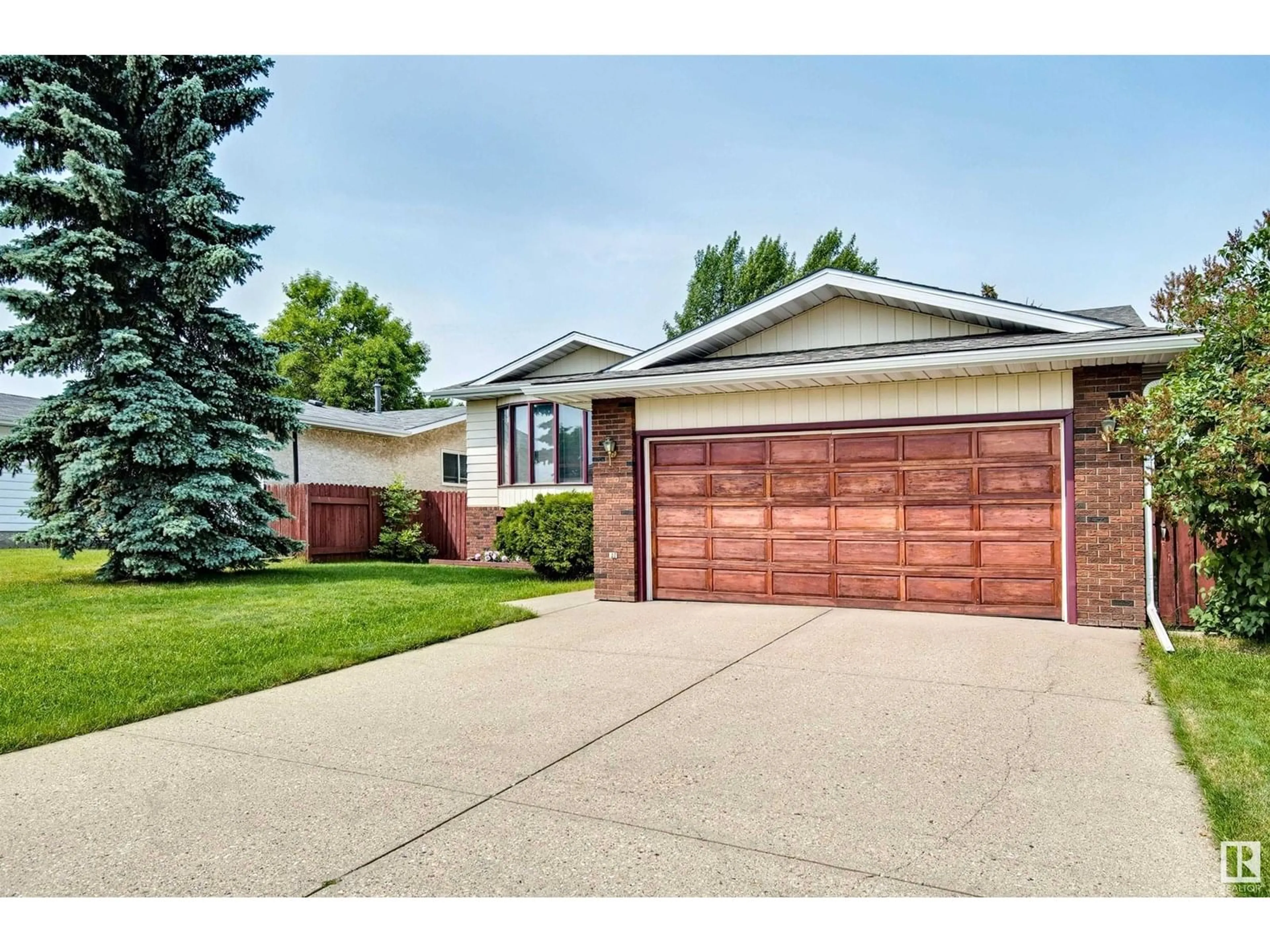 Home with brick exterior material, street for 2420 78 ST, Edmonton Alberta T6K3W4