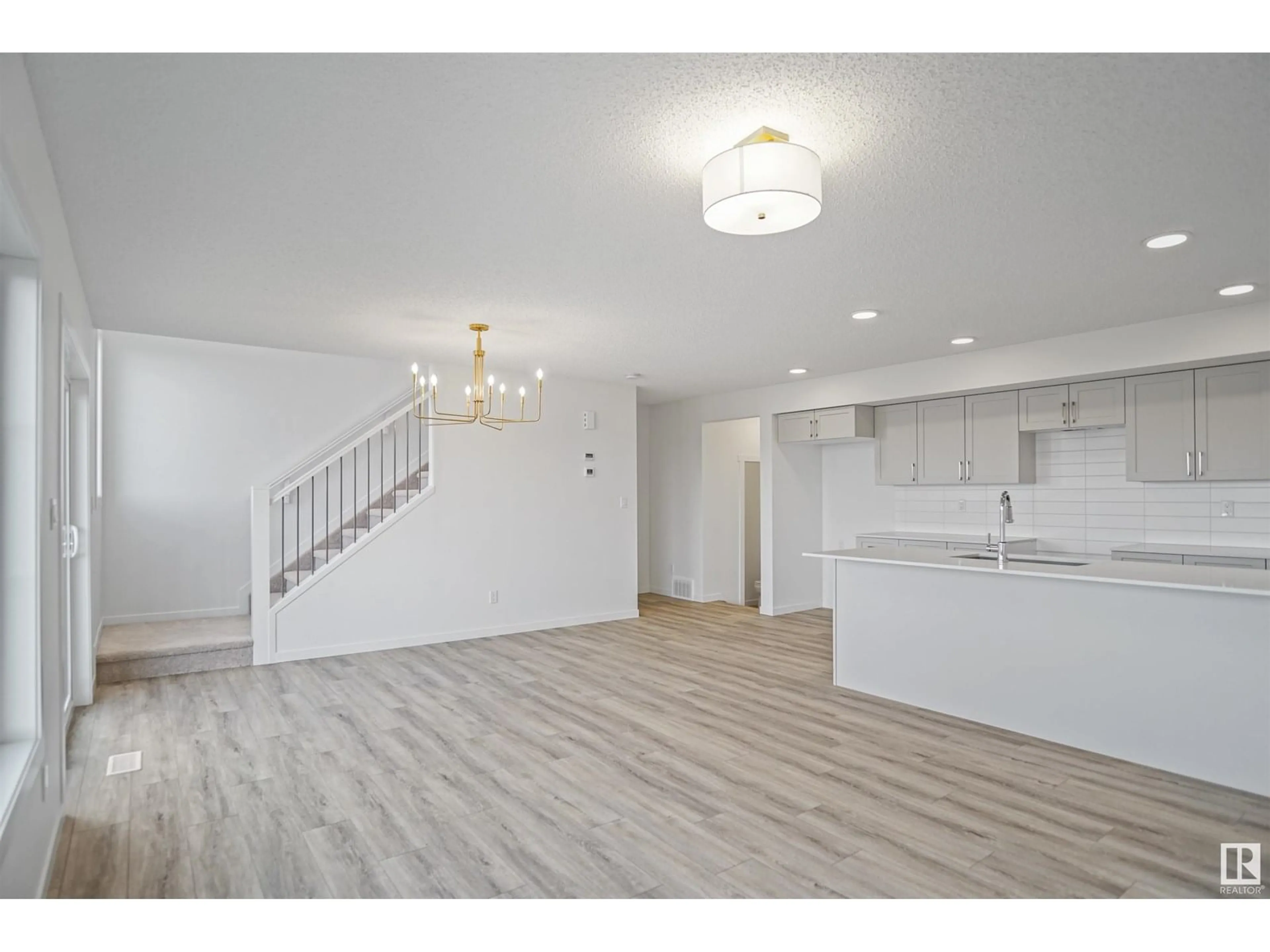 Open concept kitchen, wood/laminate floor for #19 - 19904 31 AV, Edmonton Alberta T6M1N7