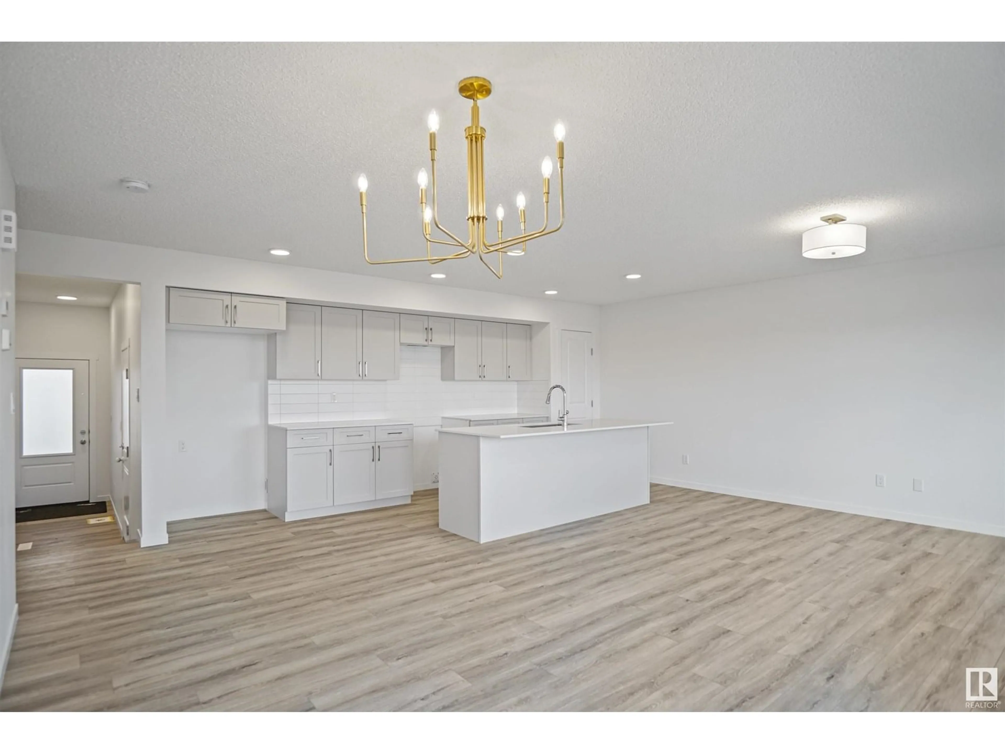 Open concept kitchen, wood/laminate floor for #19 - 19904 31 AV, Edmonton Alberta T6M1N7