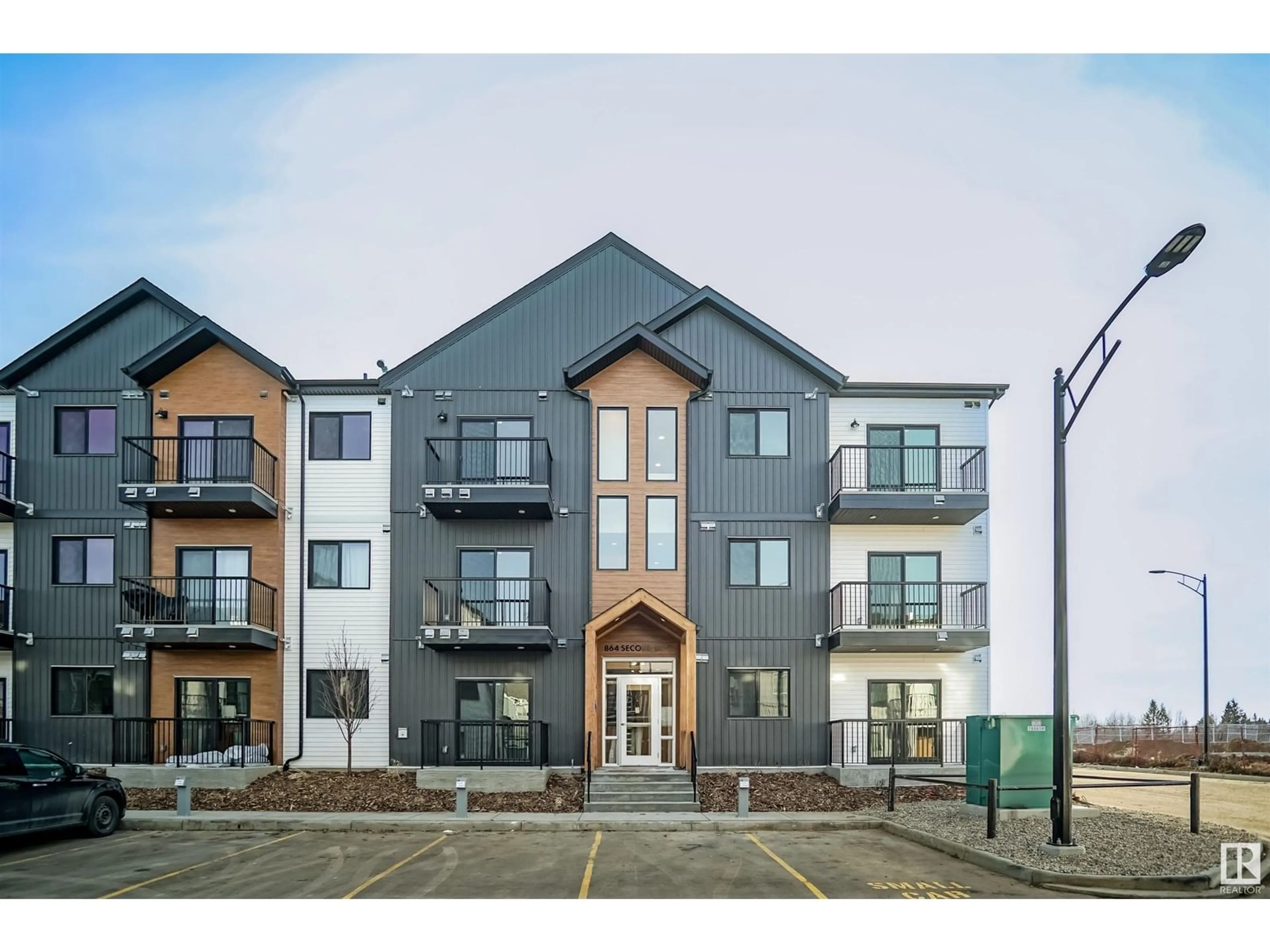 A pic from outside/outdoor area/front of a property/back of a property/a pic from drone, building for #102 - 9211 228 ST NW, Edmonton Alberta T5T7R9
