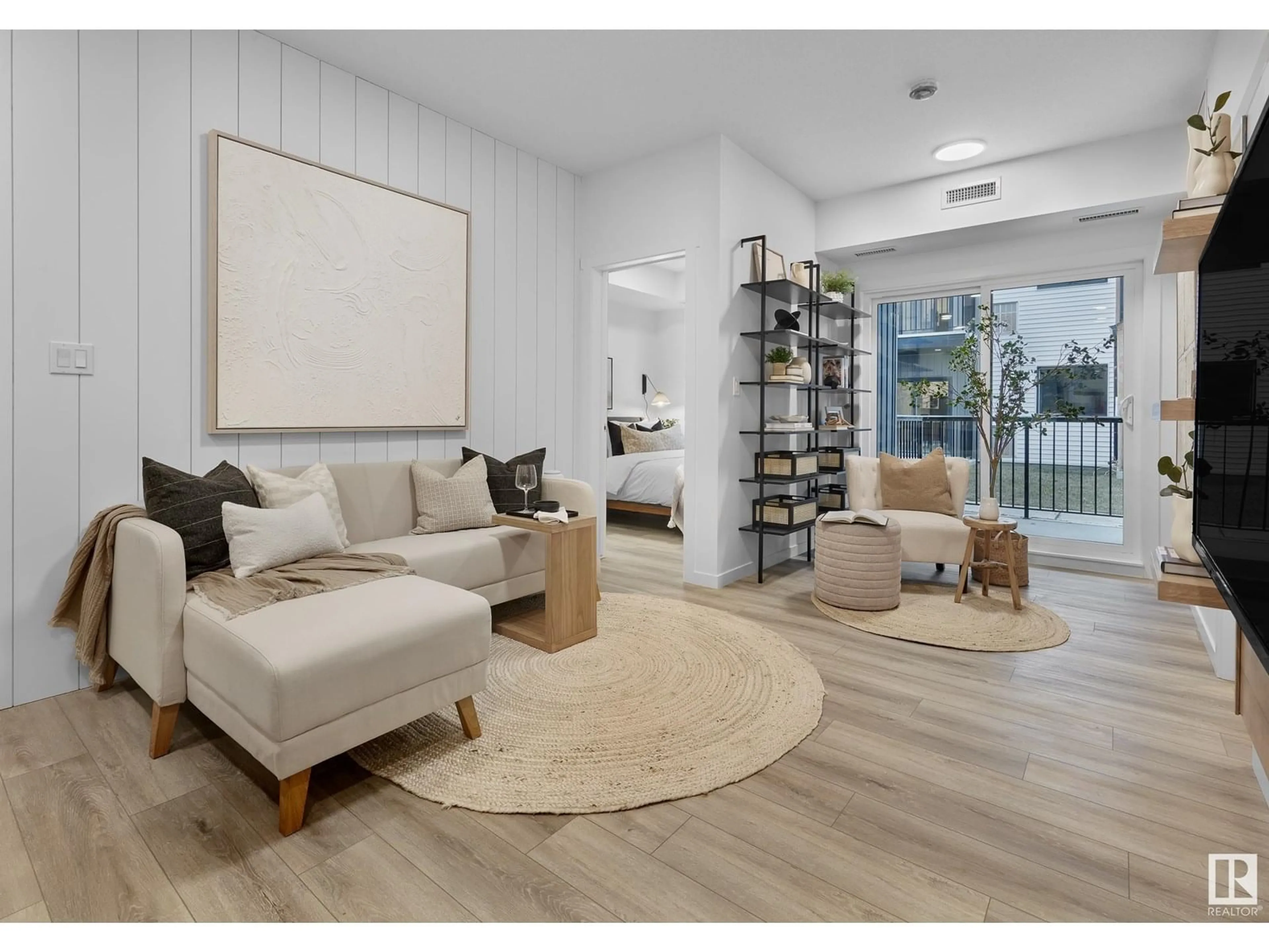 Living room with furniture, wood/laminate floor for #102 - 9211 228 ST NW, Edmonton Alberta T5T7R9