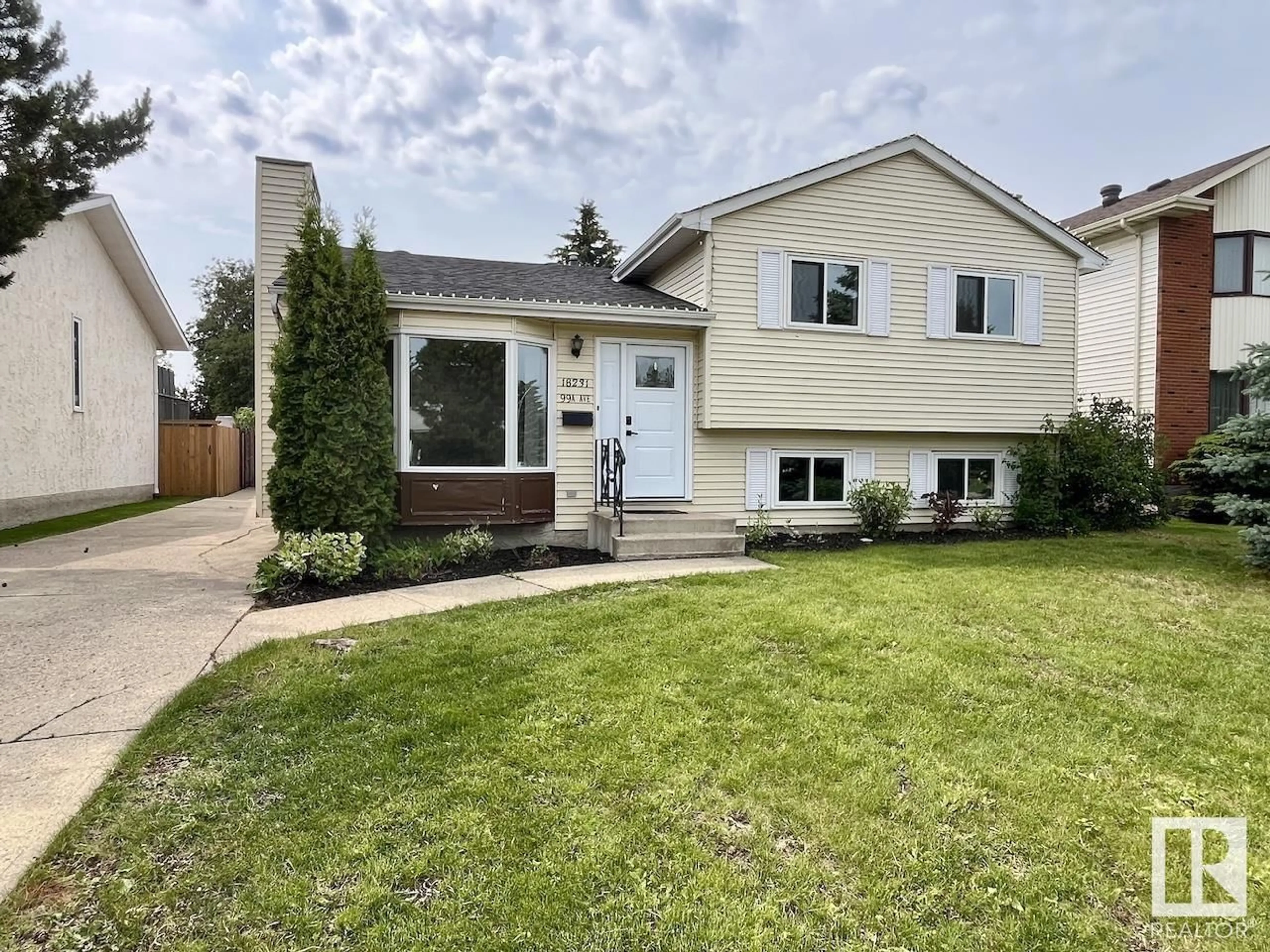 Home with vinyl exterior material, street for 18231 99A AV, Edmonton Alberta T5T4G9