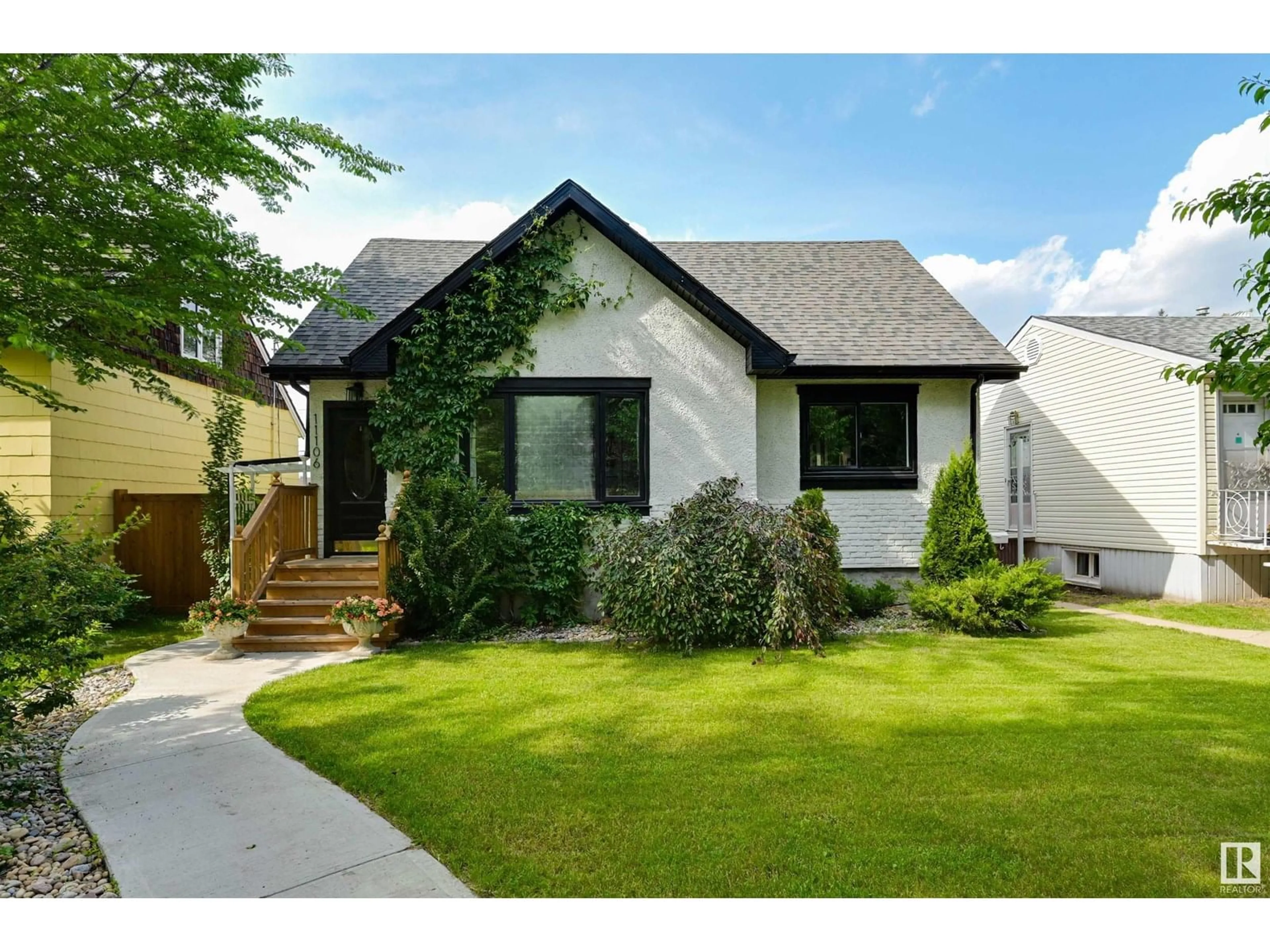 Home with vinyl exterior material, street for 11106 64 AV, Edmonton Alberta T6H1T5