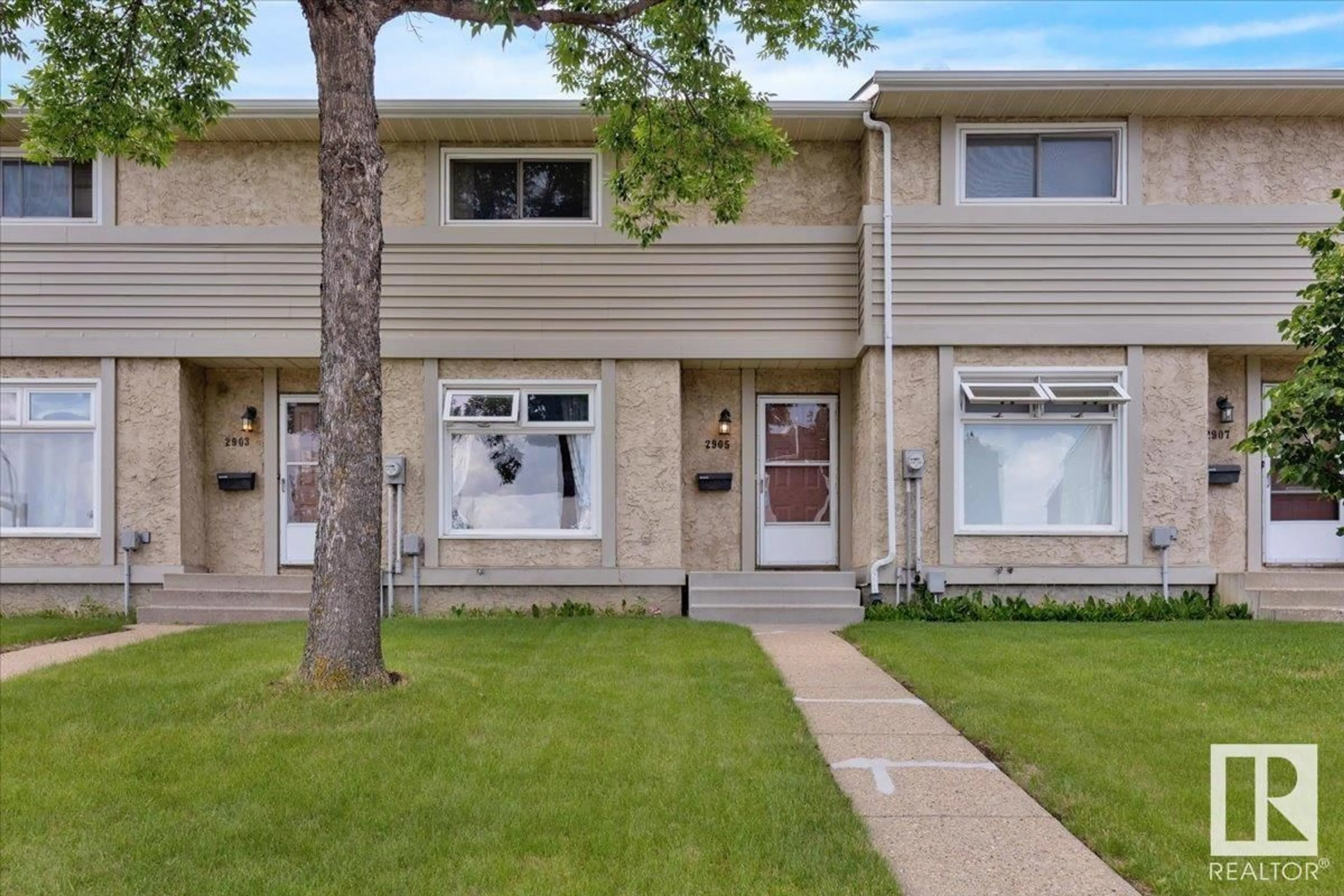 Home with vinyl exterior material, street for 2905 151 AV, Edmonton Alberta T5Y2E3