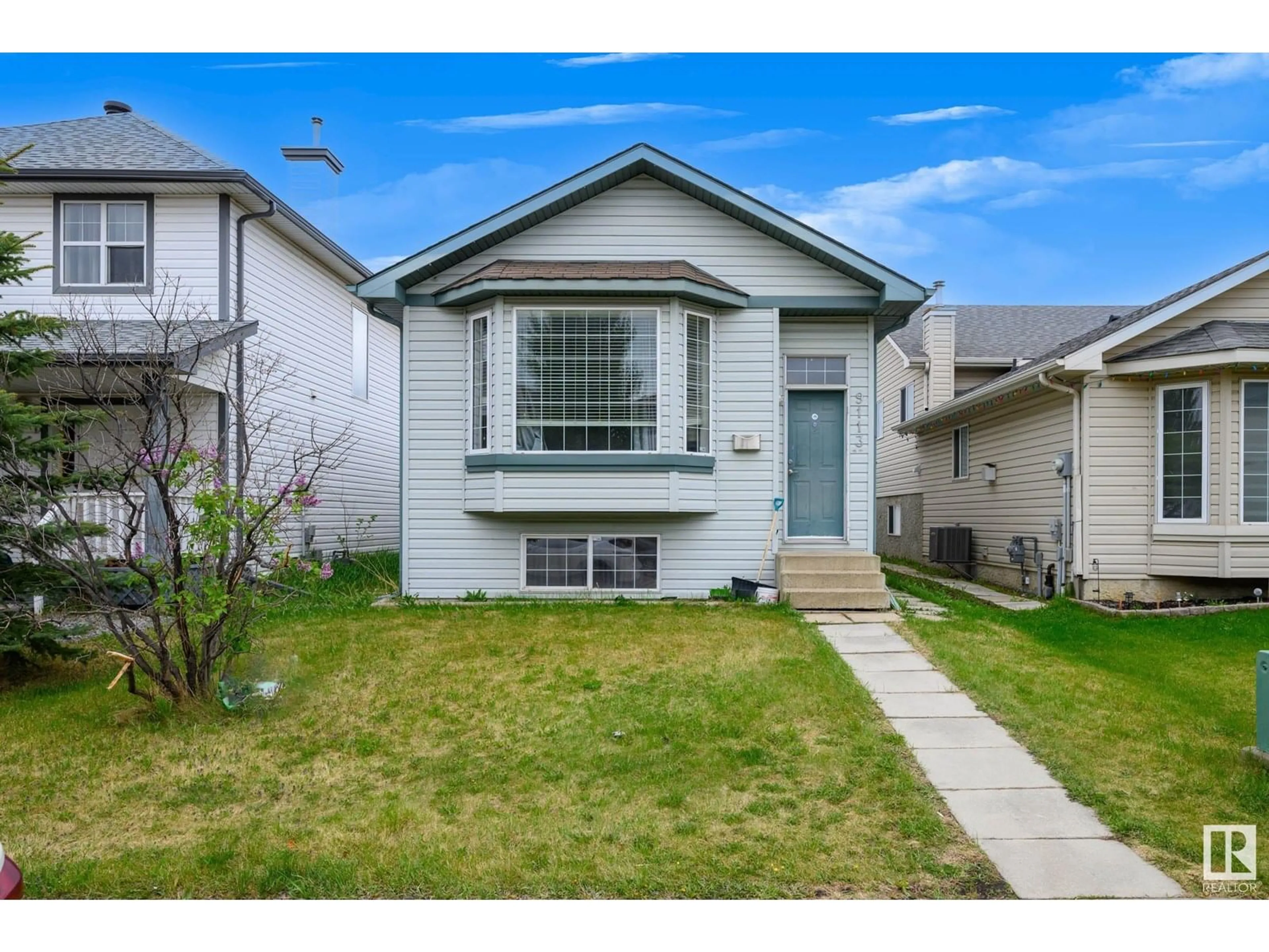 Home with vinyl exterior material, street for 9113 166 AV, Edmonton Alberta T5Z3H5