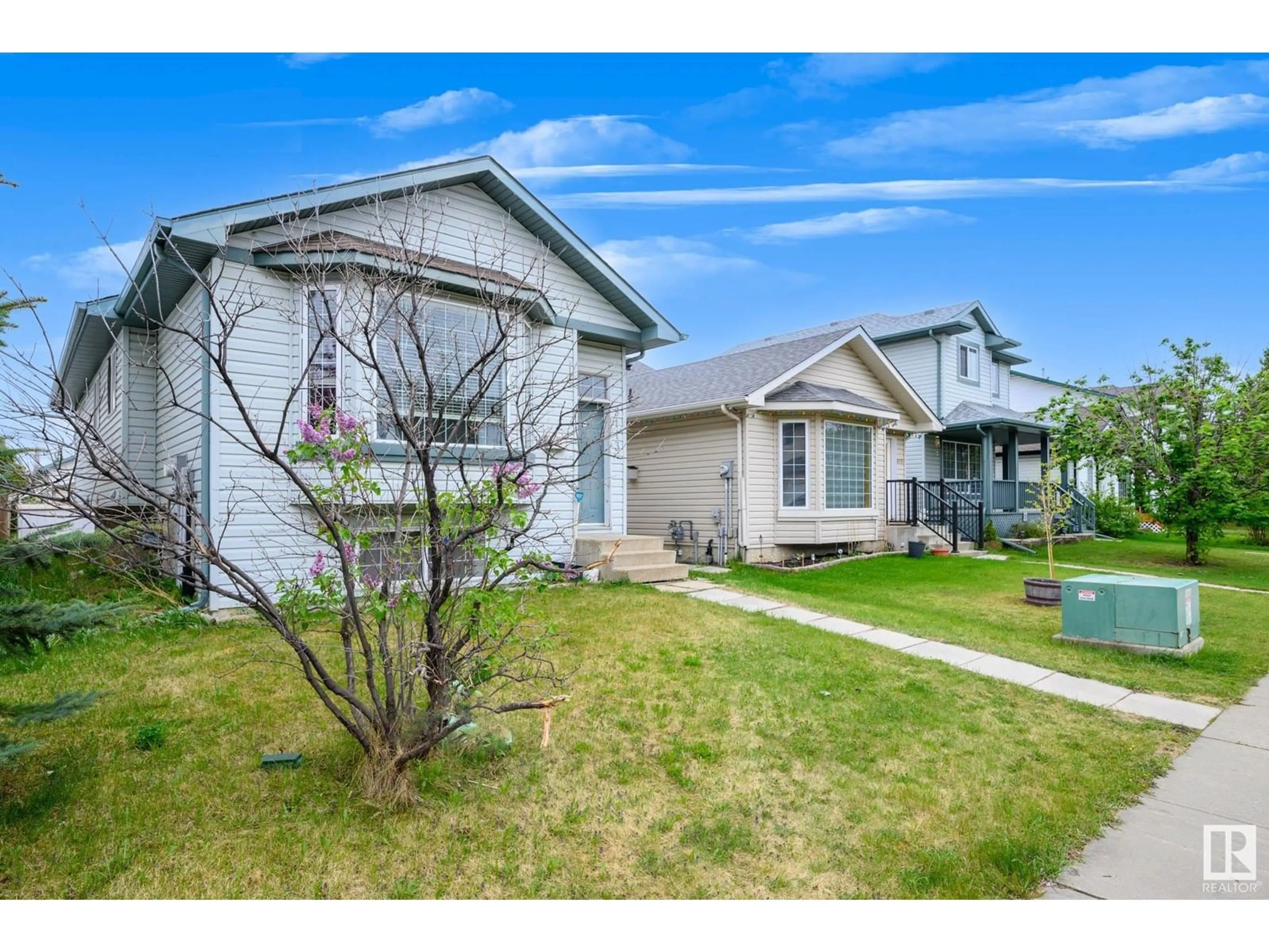 Home with vinyl exterior material, street for 9113 166 AV, Edmonton Alberta T5Z3H5