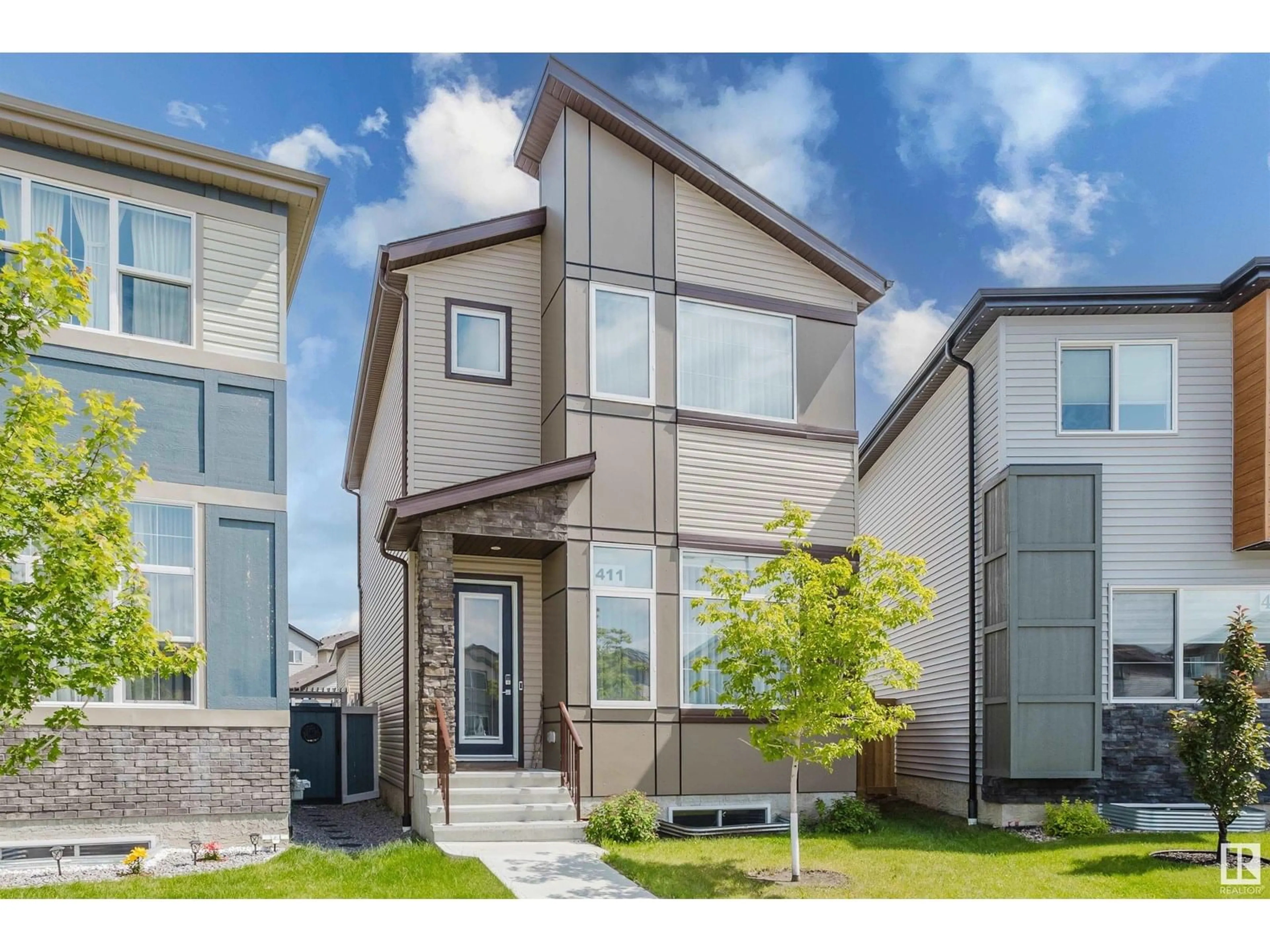 Home with vinyl exterior material, street for 411 37 AV, Edmonton Alberta T6T2L7