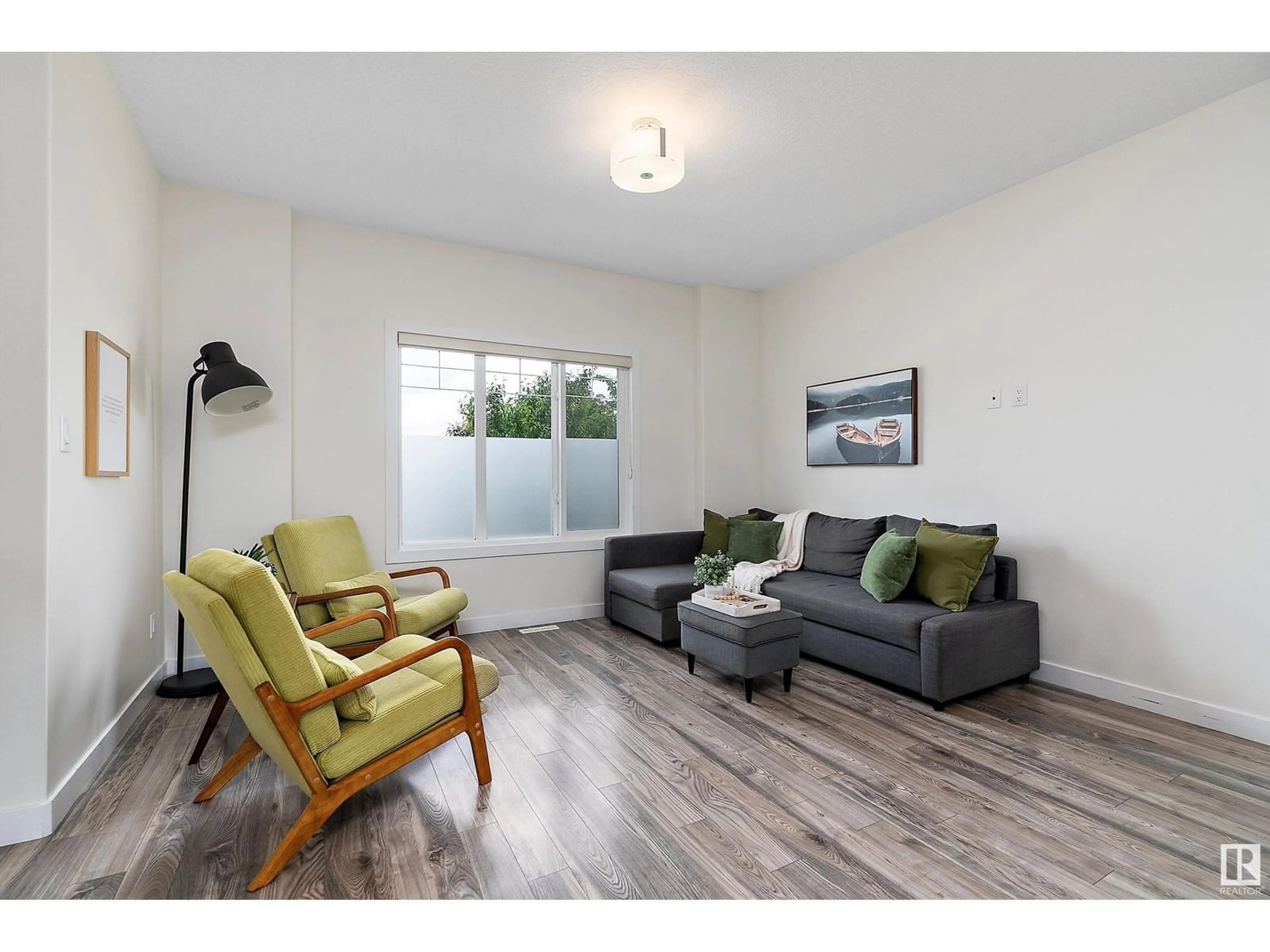 Living room with furniture, wood/laminate floor for 295 AMEENA DR, Leduc Alberta T9E1H9