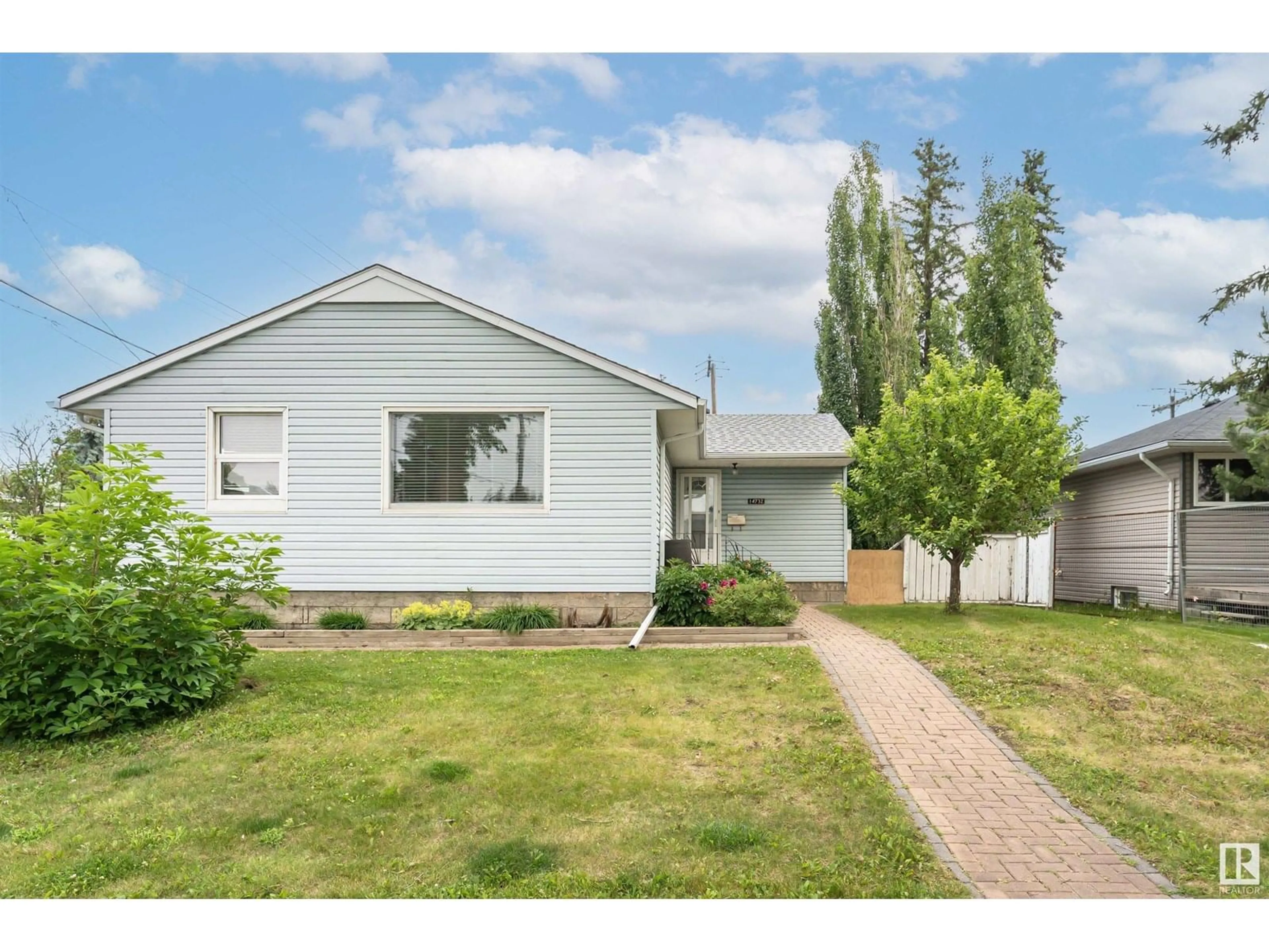 Home with vinyl exterior material, street for NW - 14732 91 AV, Edmonton Alberta T5R4Z1