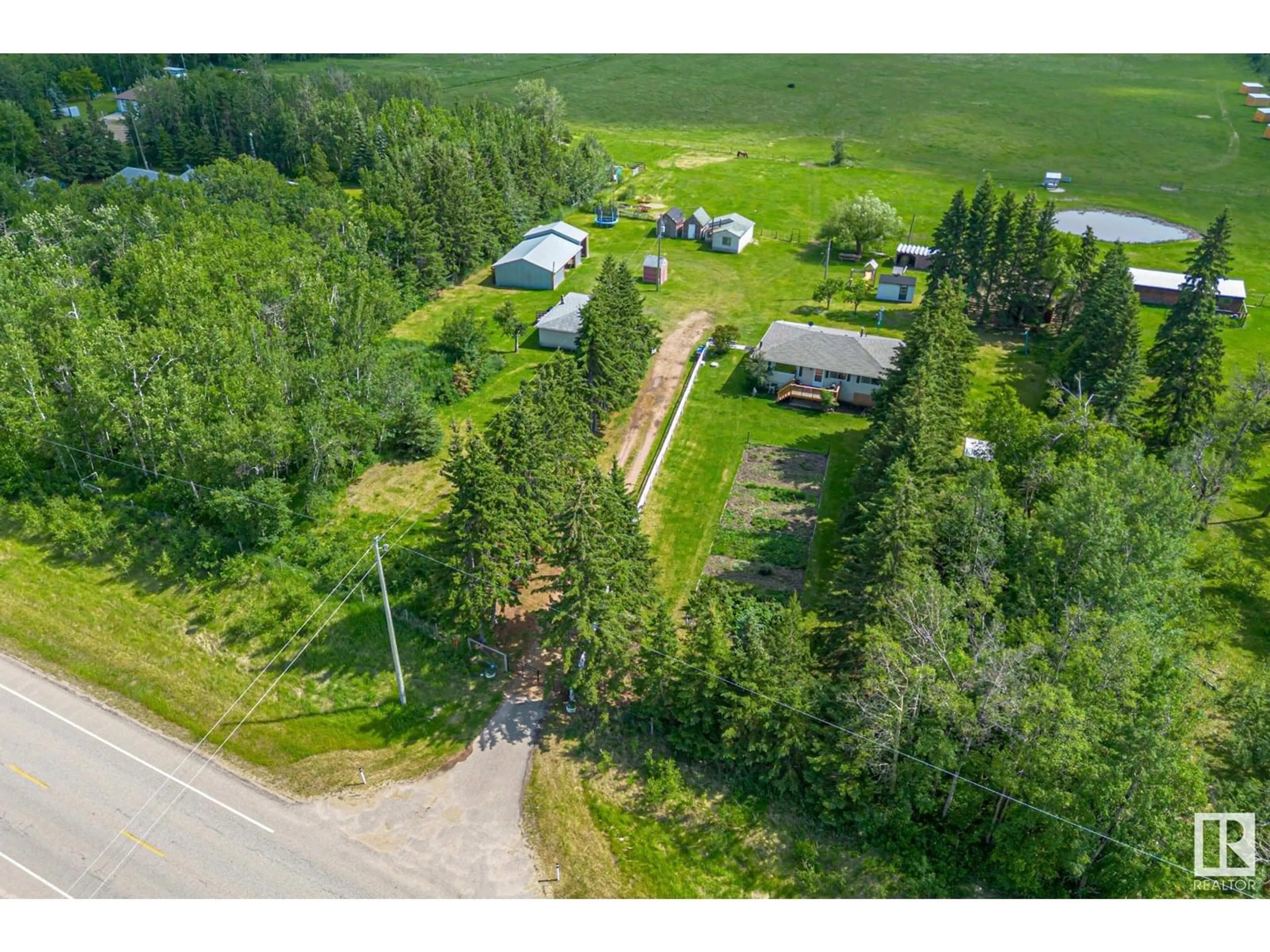 A pic from outside/outdoor area/front of a property/back of a property/a pic from drone, unknown for 22037 TWP ROAD 520, Rural Strathcona County Alberta T8A1A6