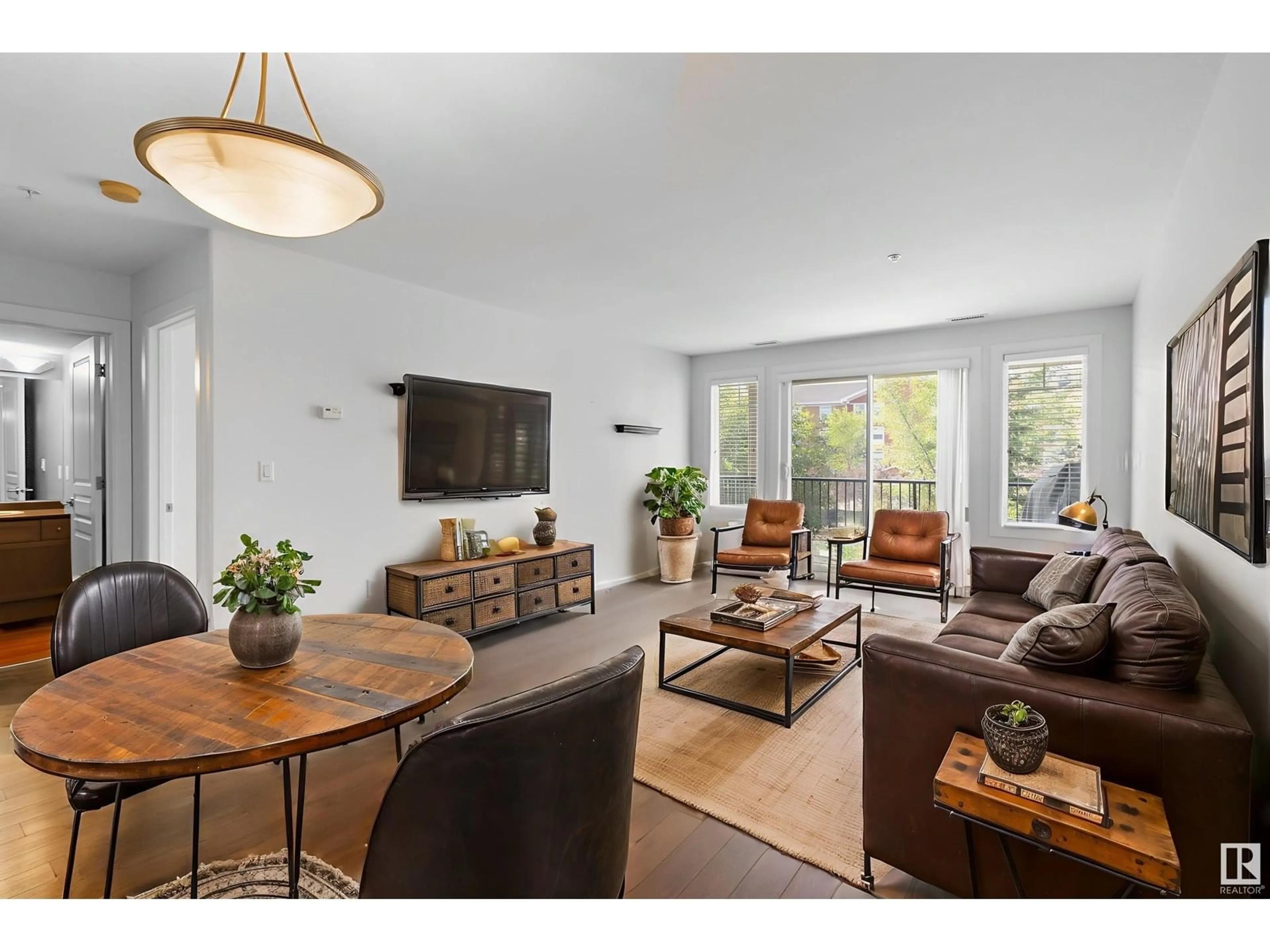 Living room with furniture, wood/laminate floor for 227 - 300 PALISADES WY, Sherwood Park Alberta T8H2T9
