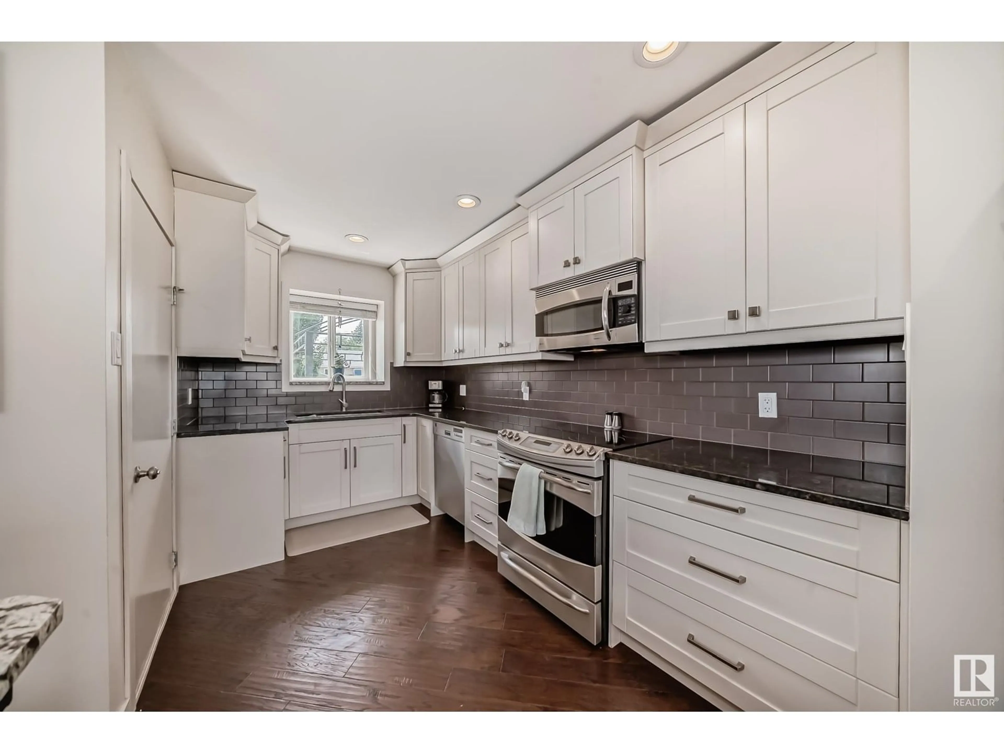 Open concept kitchen, ceramic/tile floor for 13615 135A AV, Edmonton Alberta T5L3Z8