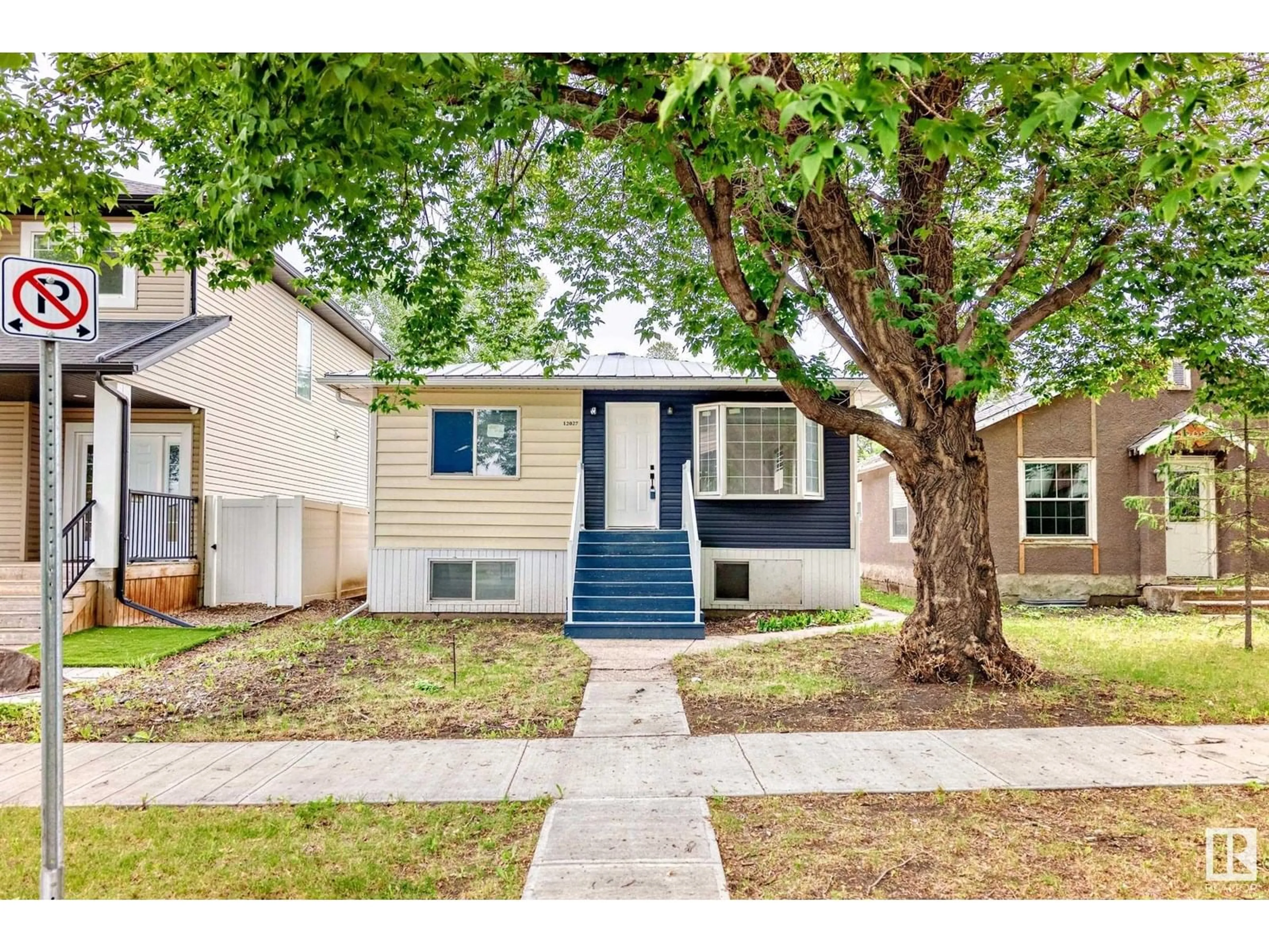 Home with vinyl exterior material, street for 12027 69 ST, Edmonton Alberta T5B1S7