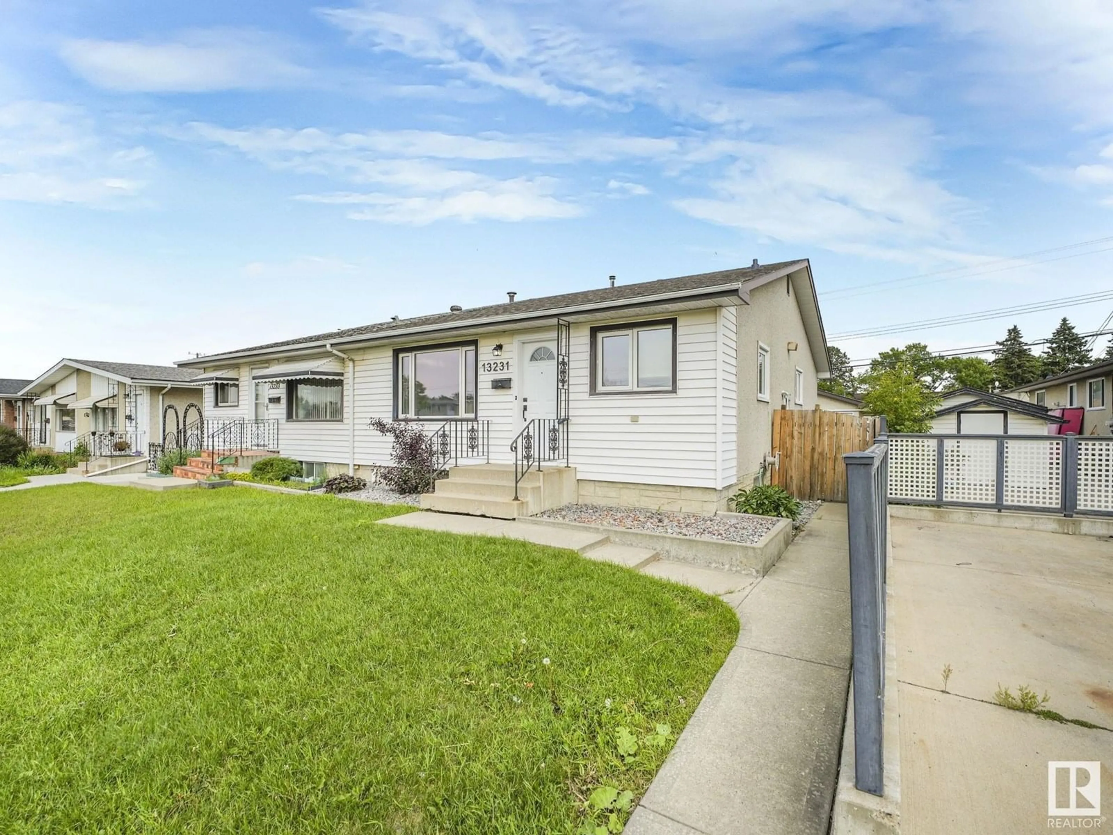 Home with vinyl exterior material, street for NW - 13231 82 ST, Edmonton Alberta T5E2T9