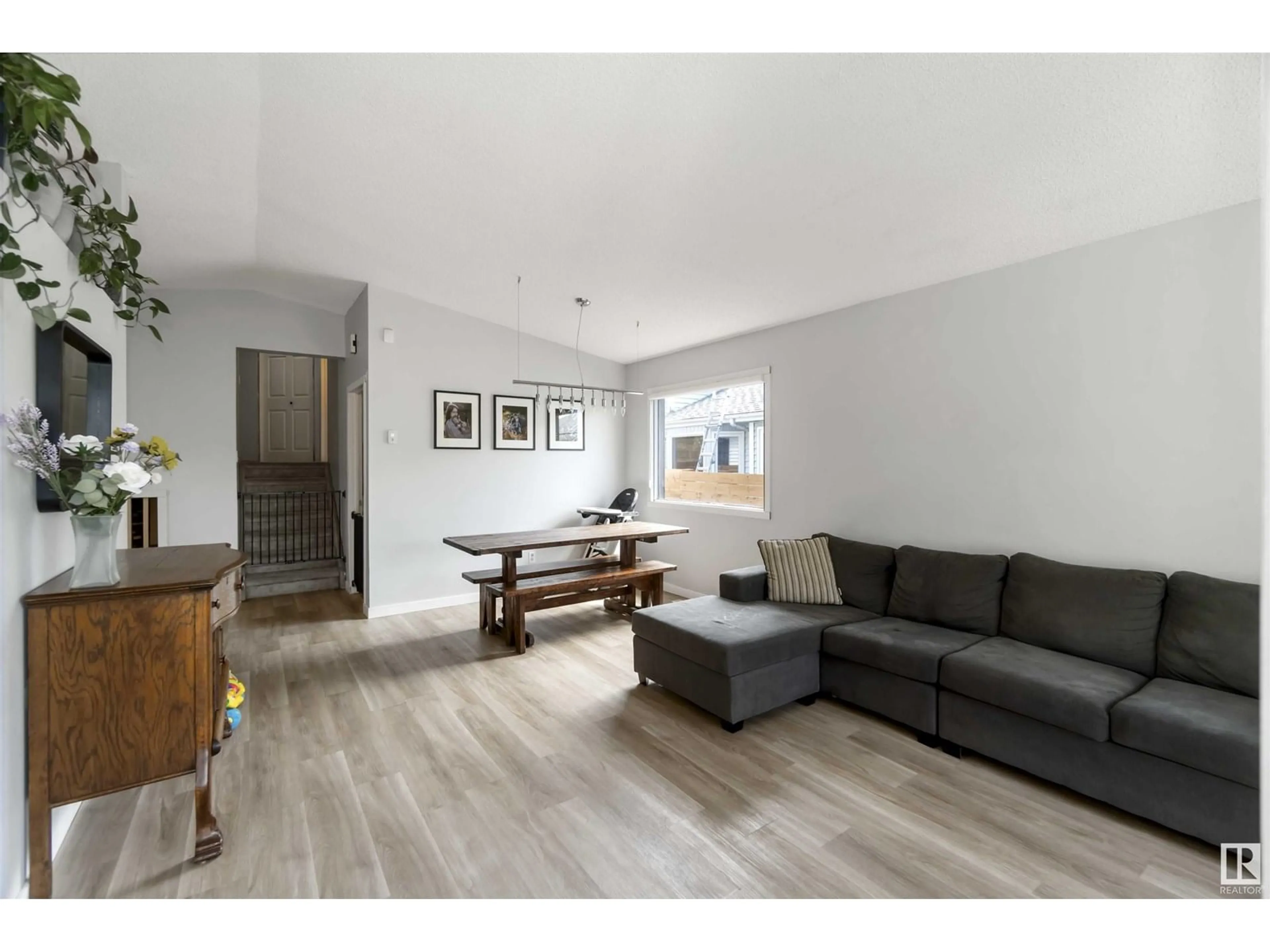 Living room with furniture, wood/laminate floor for NW - 3313 43 ST, Edmonton Alberta T6L5Z6