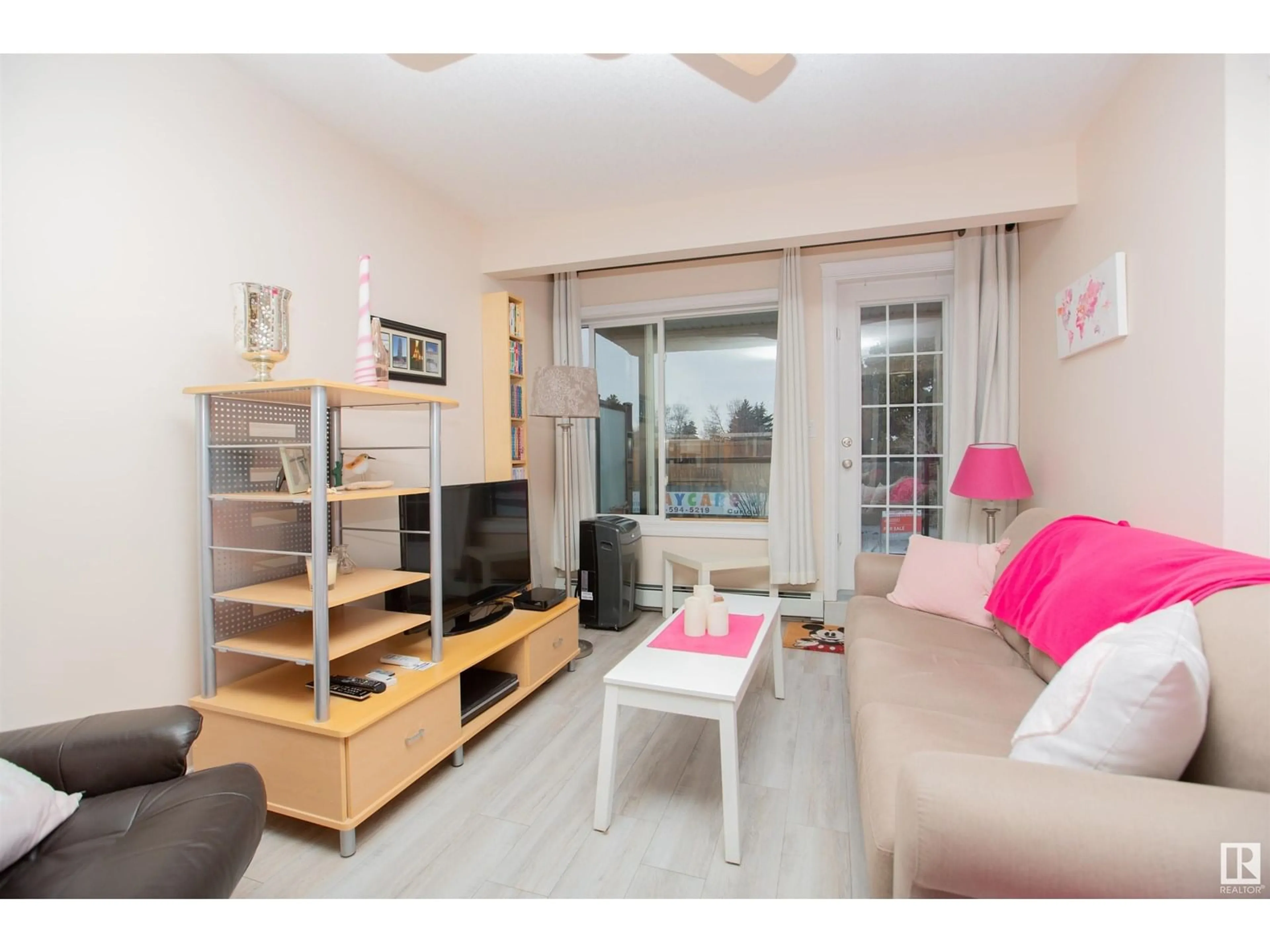 Living room with furniture, wood/laminate floor for #213 - 11033 127 ST, Edmonton Alberta T5M0T3