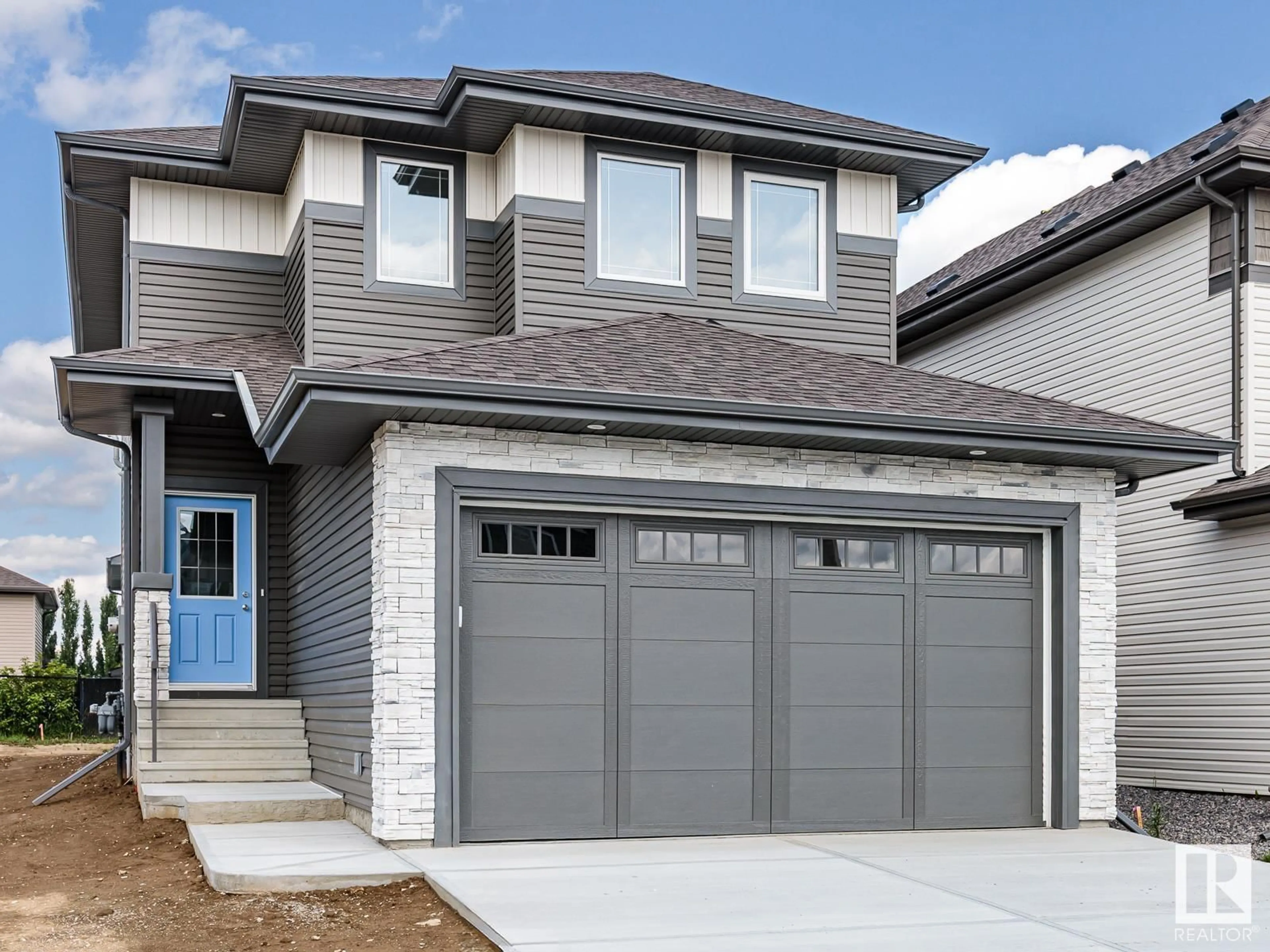 Home with vinyl exterior material, street for 74 SILVERSTONE DR, Stony Plain Alberta T7Z0E8