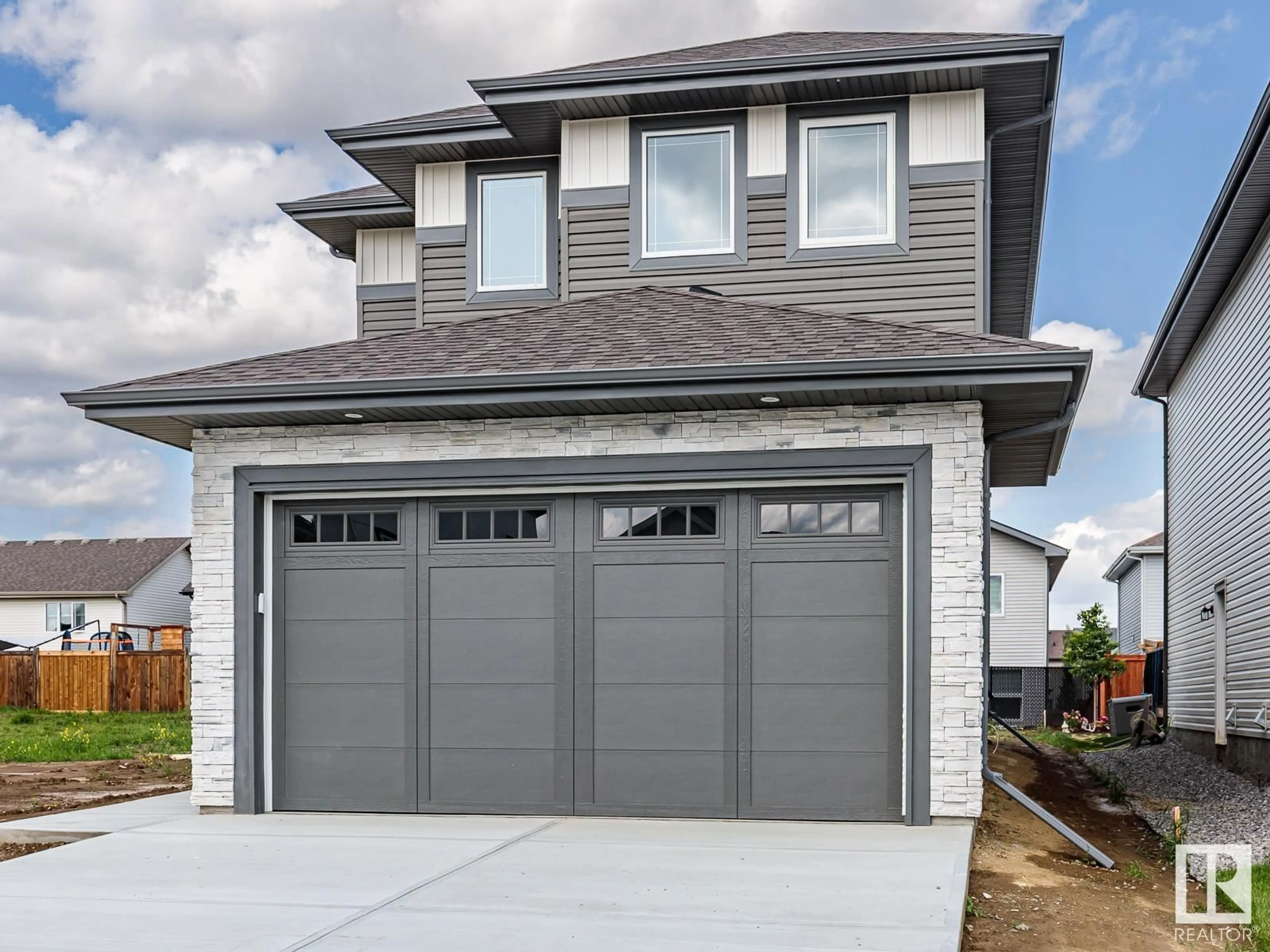 Home with vinyl exterior material, street for 74 SILVERSTONE DR, Stony Plain Alberta T7Z0E8