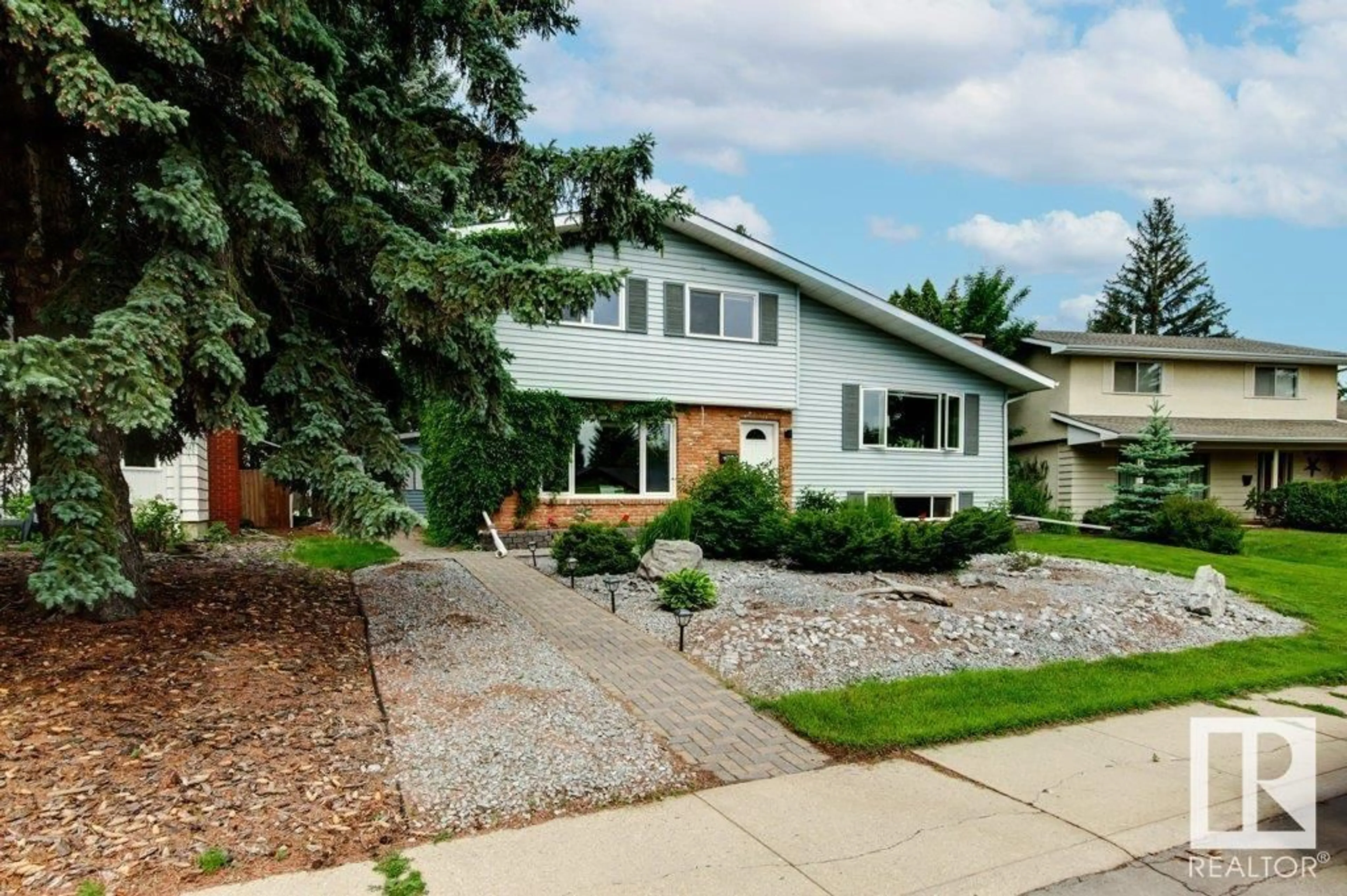 Home with brick exterior material, street for NW - 4128 126 ST, Edmonton Alberta T6J2A4