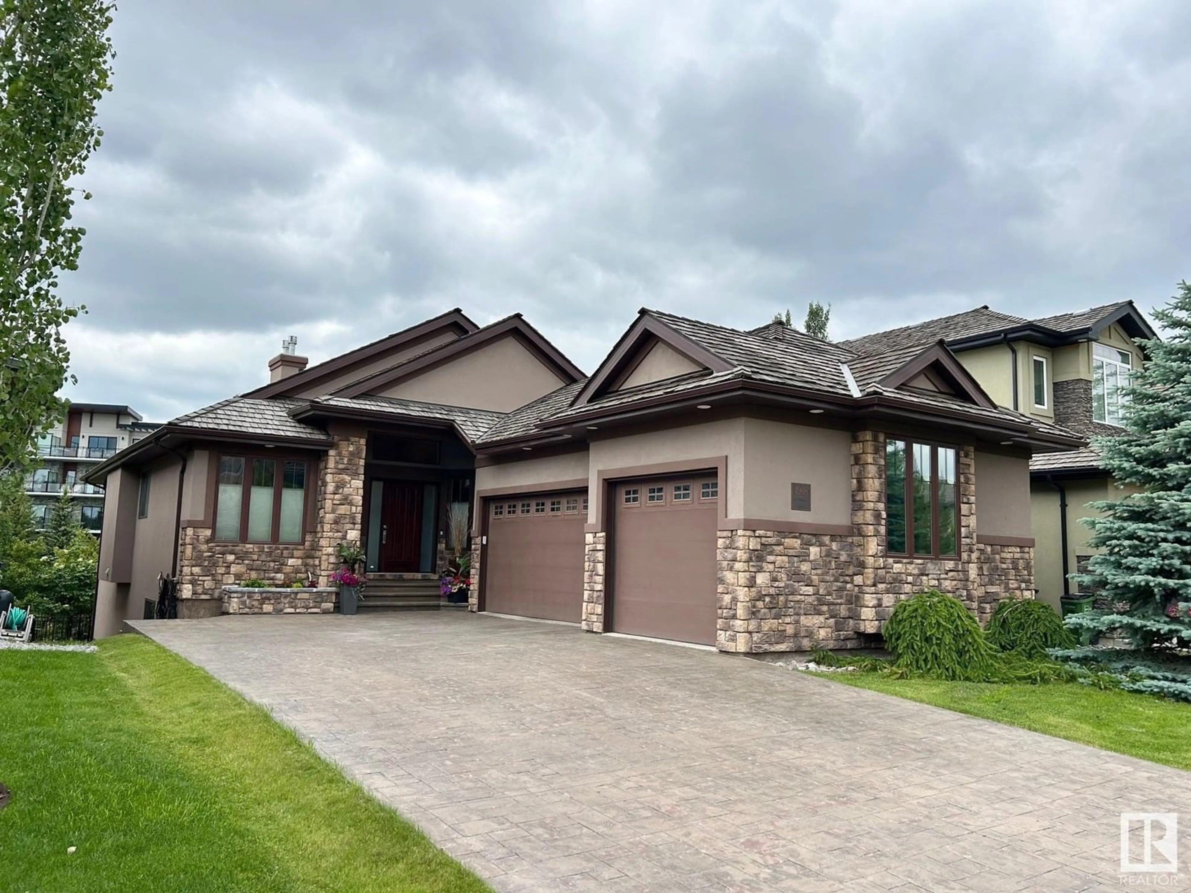 Home with brick exterior material, street for 4908 MACTAGGART CO, Edmonton Alberta T6R0J6