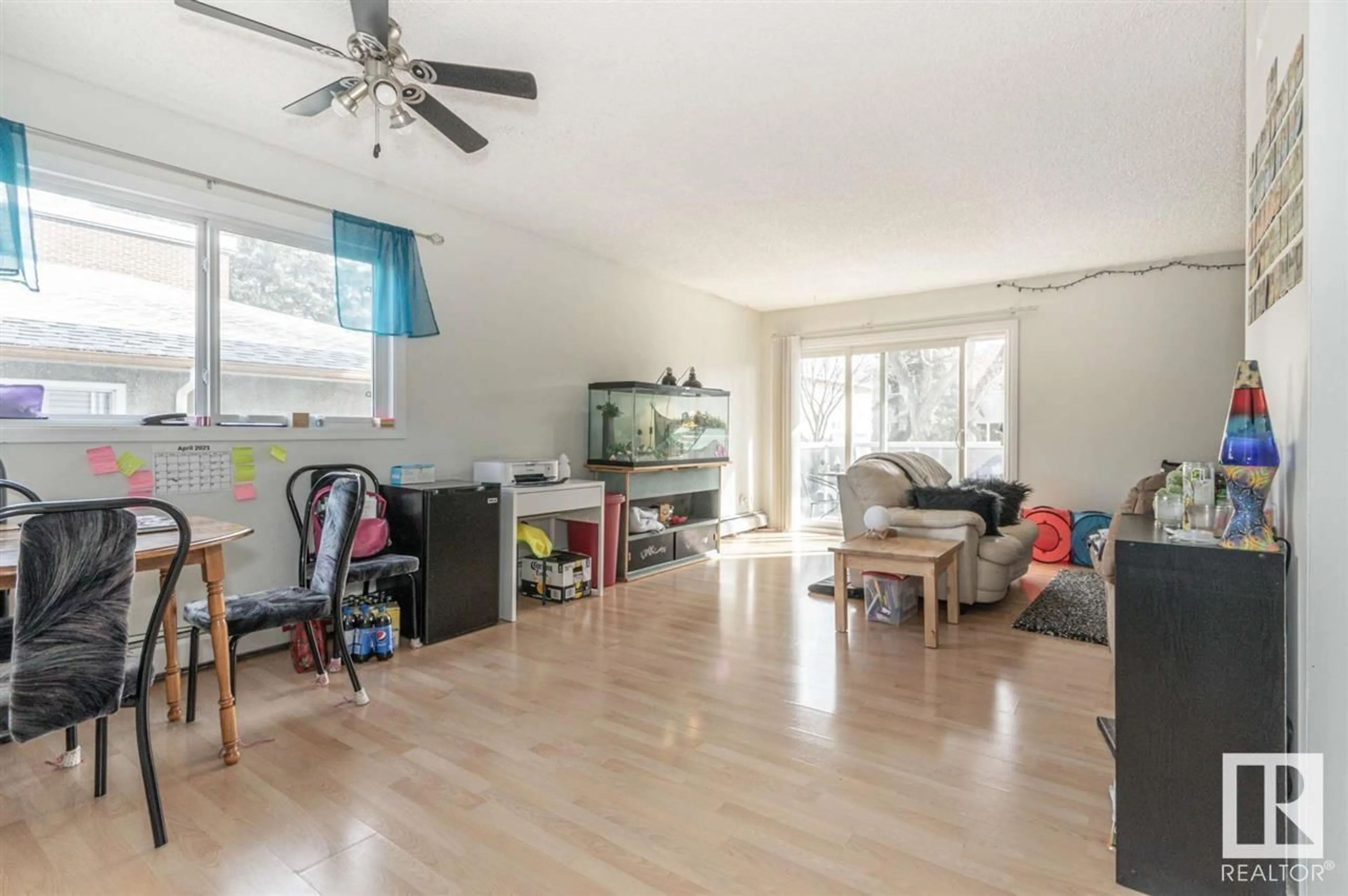 Living room with furniture, wood/laminate floor for 201 - 10738 85 AV NW, Edmonton Alberta T6E2K8