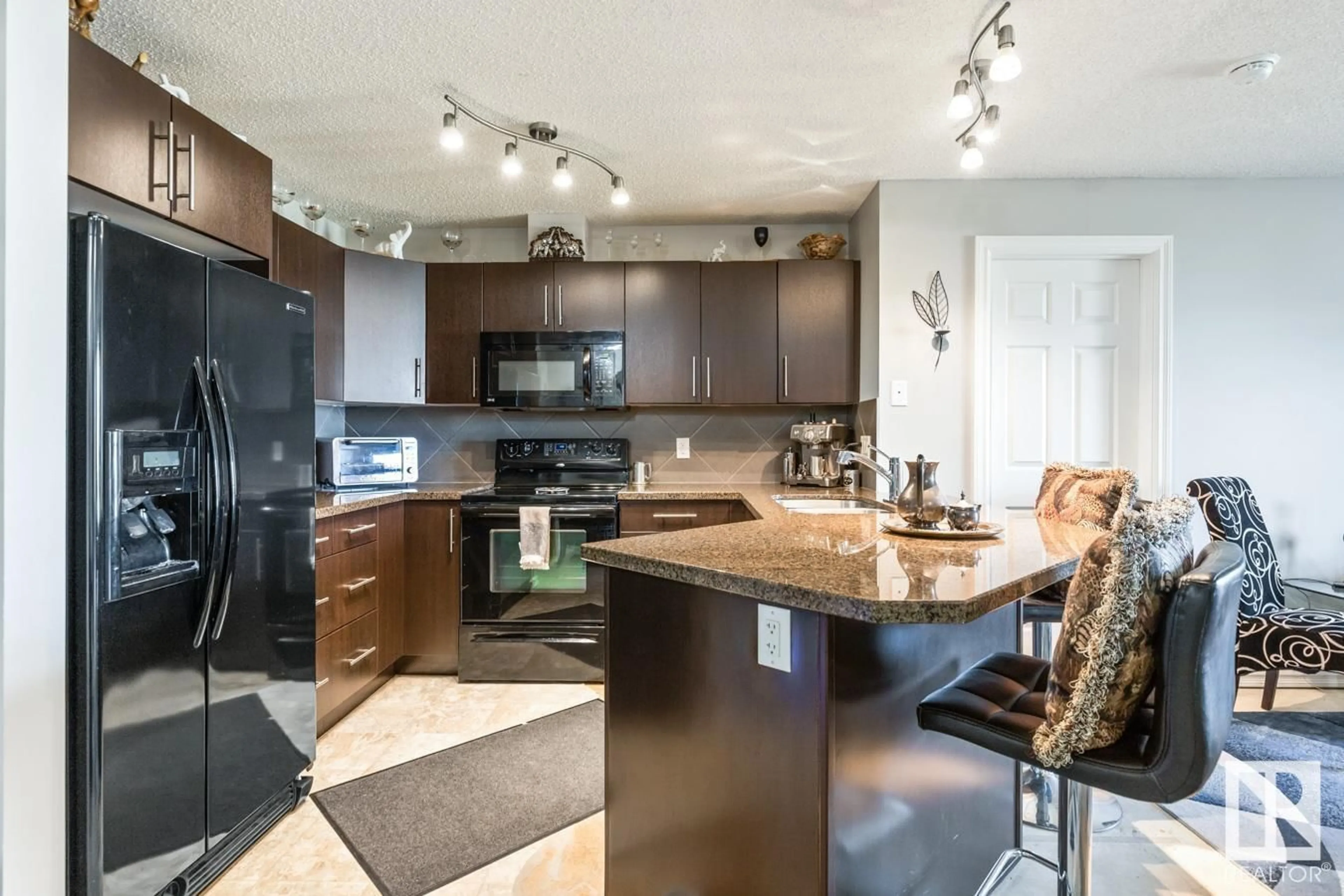 Open concept kitchen, unknown for #115 - 2208 44 AV, Edmonton Alberta T6T0G6