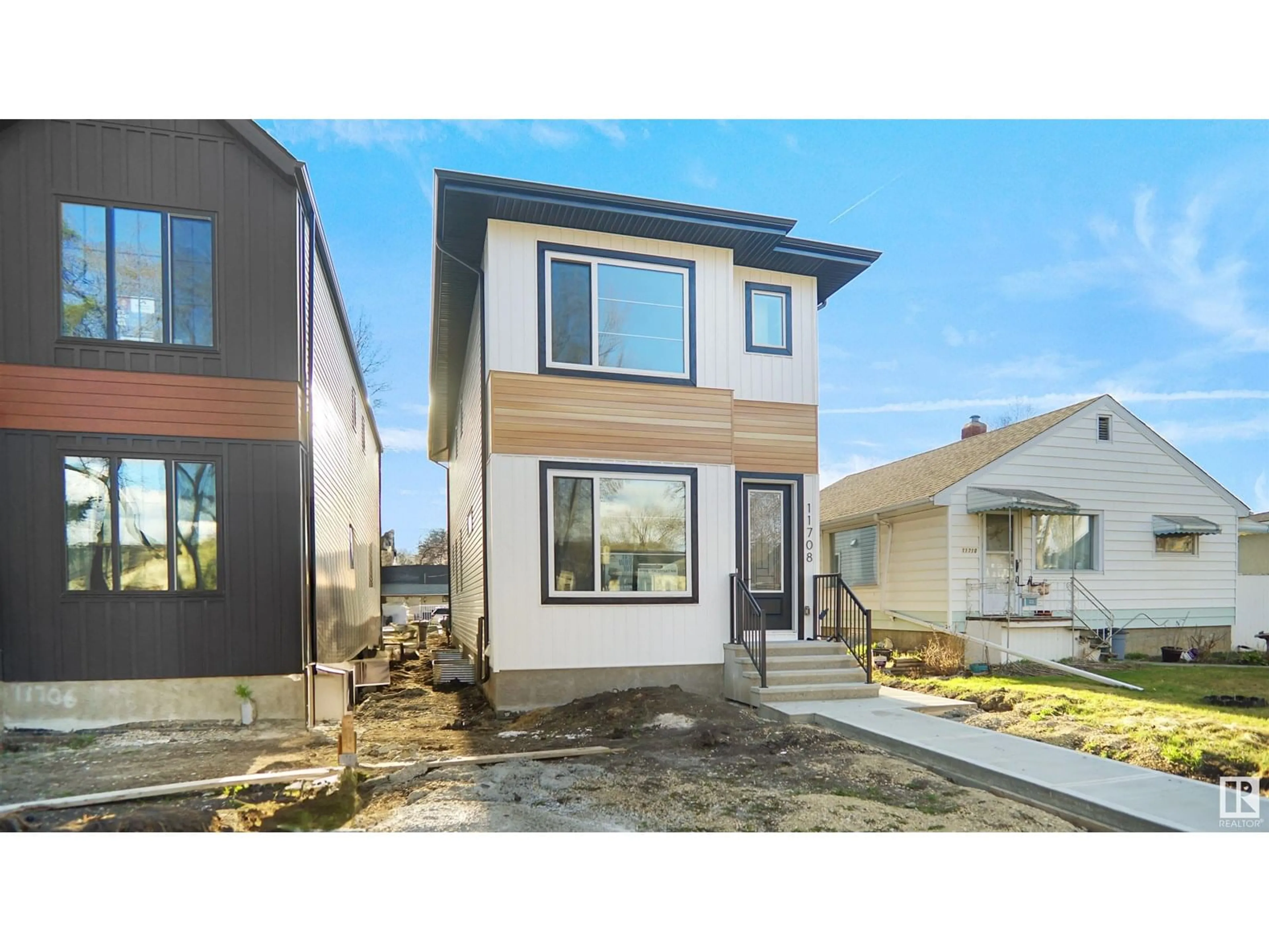 Home with vinyl exterior material, street for 11708 126 ST, Edmonton Alberta T5M0S2