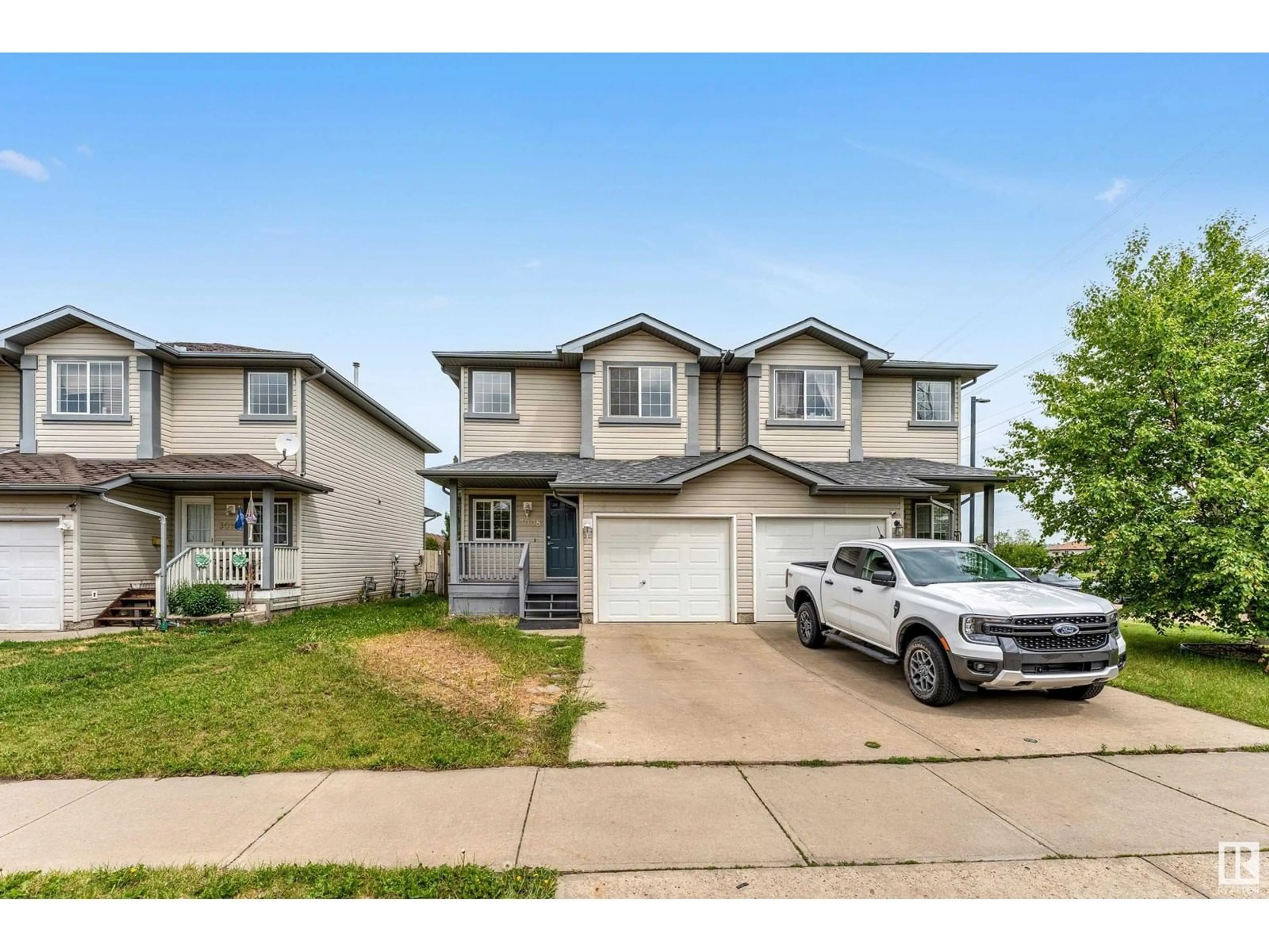 Home with vinyl exterior material, street for 3008 31 AVENUE, Edmonton Alberta T6T1W9